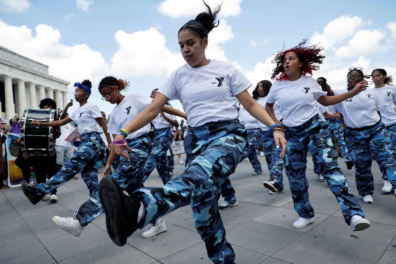 Members of Temple Guard drill team from York (Pennsylvania) YMCA perform as demonstrators for racial justice gather on the 60th anniversary of the March On Washington and Martin Luther King Jr's historic "I Have a Dream" speech at the Lincoln Memorial in Washington D.C, U.S., August 26, 2023. REUTERS/Jonathan Ernst