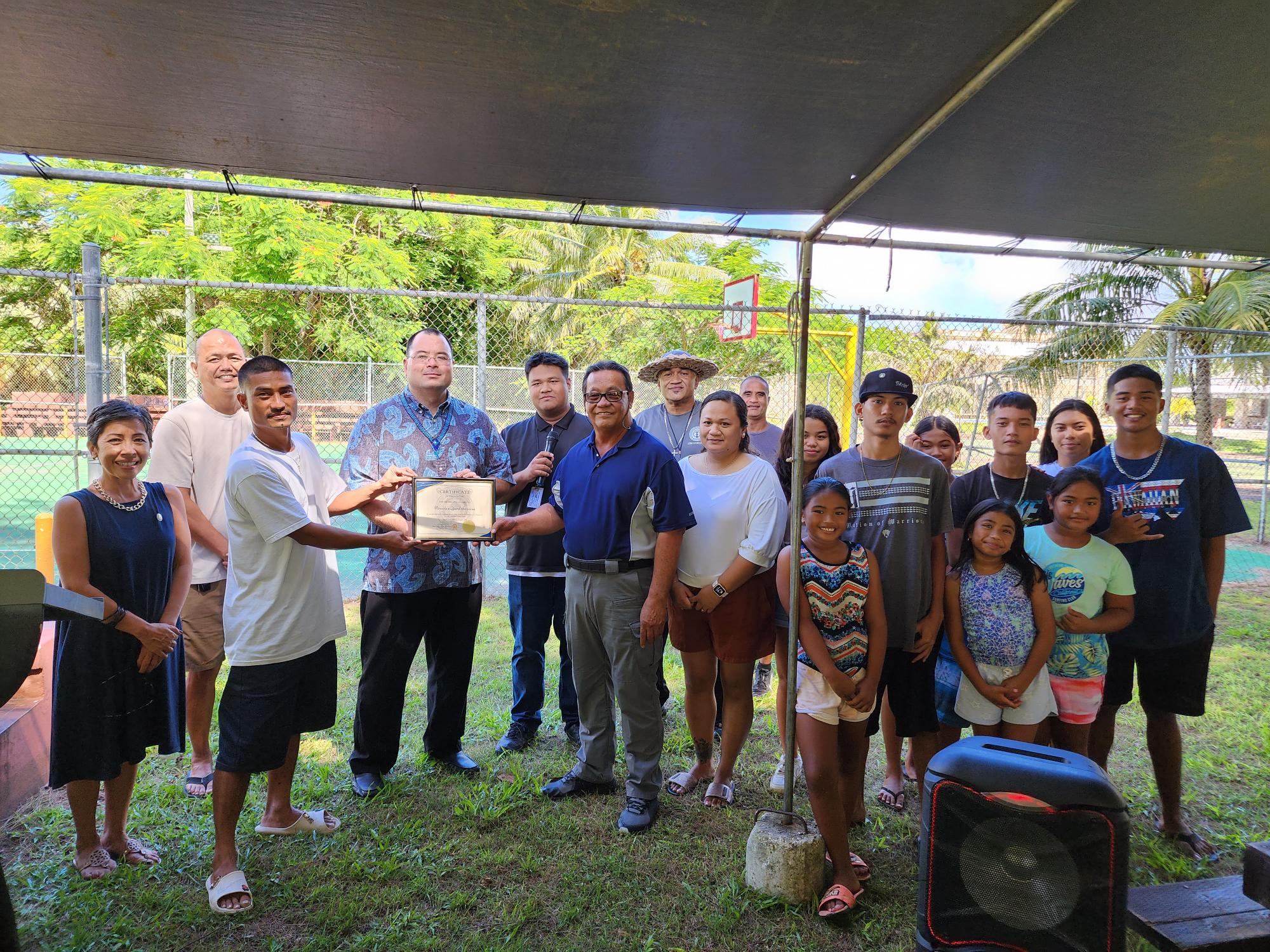 Speaker Edmund Villagomez, Reps. Marissa Flores and Vincent Aldan joined Saipan Mayor Ramon "RB" Camacho and Vincole Lawncare Services during an "adoption" ceremony for the Laly 4 basketball court in Chalan Kanoa.