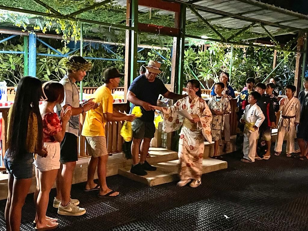 Saipan Mayor RB Camacho and the CNMI youth senators hand out the certificates of appreciation to the exchange students during a farewell dinner.