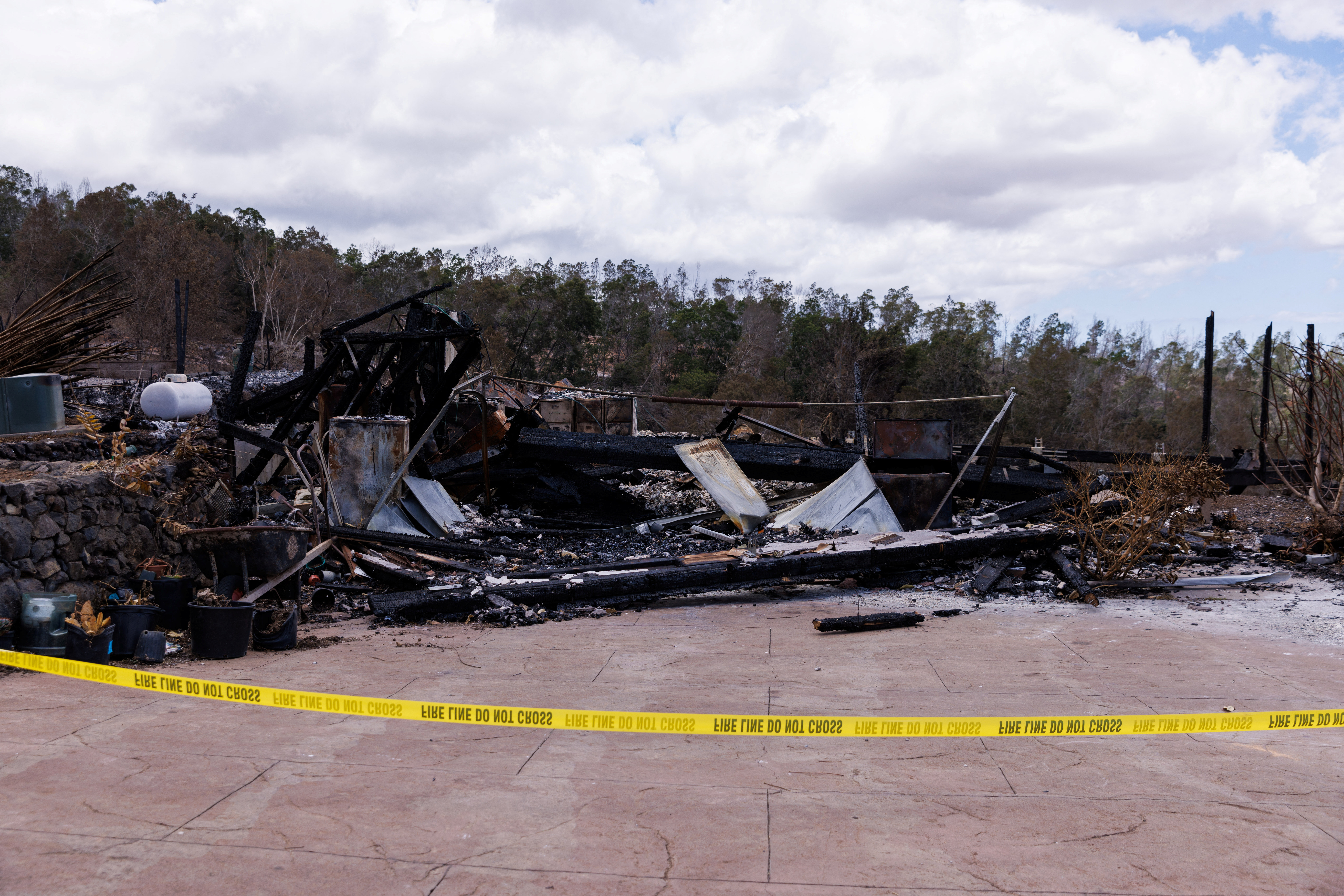 A view of the remains of a building after it was destroyed during wildfires, in Kula, Maui island, Hawaii, U.S., August 13, 2023. REUTERS/Mike Blake