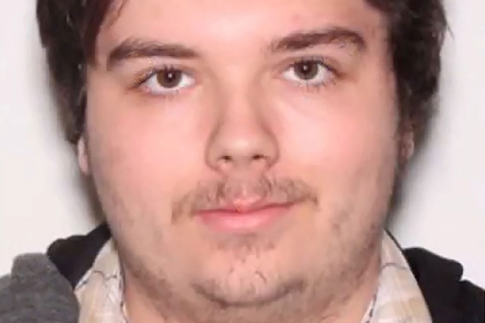 A photograph of Ryan Christopher Palmeter, 21, is shown at a news conference after being identified by Sheriff T.K. Waters as the white man who killed three Black people before shooting himself at a Dollar General store August 26, in what local law enforcement described as a racially motivated crime in Jacksonville, Florida, U.S. August 27, 2023. Jacksonville Sheriff’s Office/Handout via REUTERS.