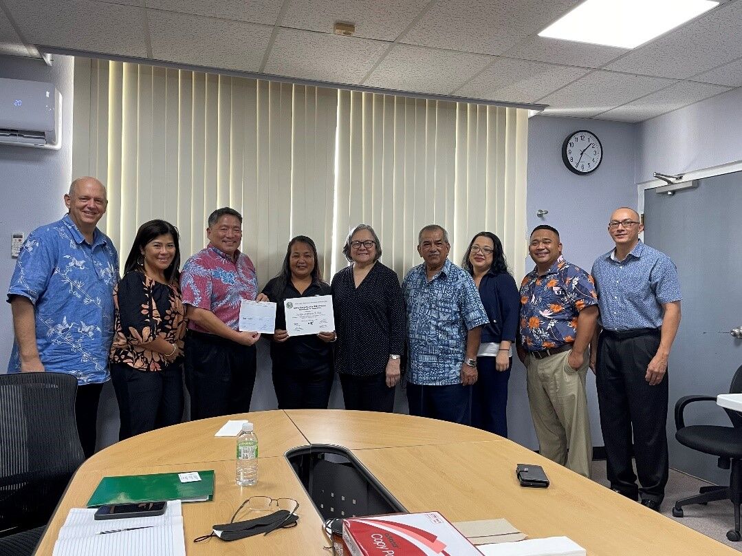 Family Self-Sufficiency  Program graduate Jocelyn T. Blas with U.S. Department of Housing & Urban Development representatives, Northern Marianas Housing Corporation  board of directors, corporate director and deputy corporate director.