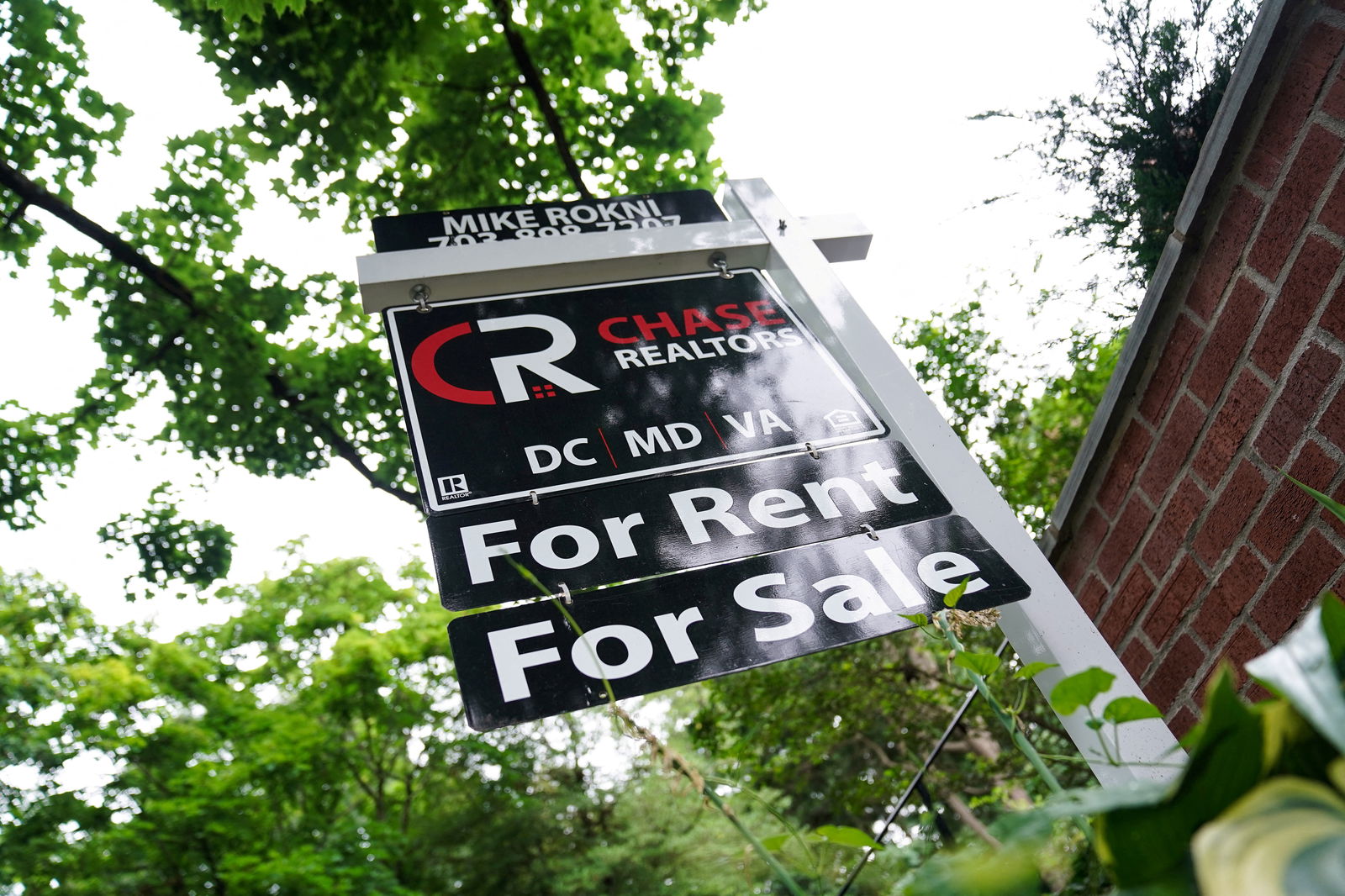 A "For Rent, For Sale" sign is seen outside of a home in Washington, July 7, 2022.