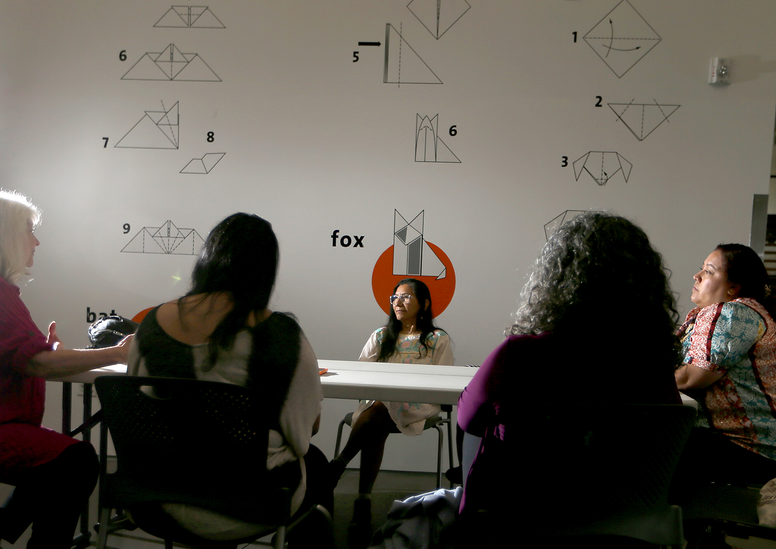 Staff members at Childrenâ€™s Institute in Los Angeles discuss the closure of the mental health triage teams they ran. (Luis Sinco/Los Angeles Times/TNS)