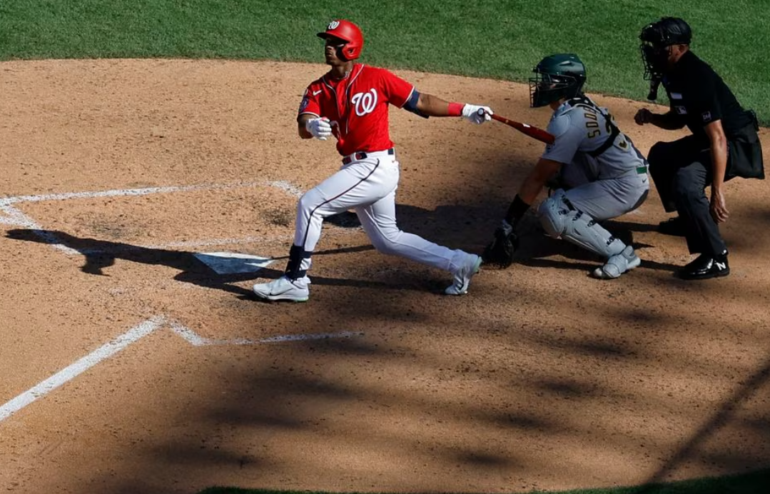 Washington Nationals second baseman Jeter Downs (3) hits a two run walk off single against the Oakland Athletics during the ninth inning at Nationals Park in Washington, D.C., Aug. 13, 2023.