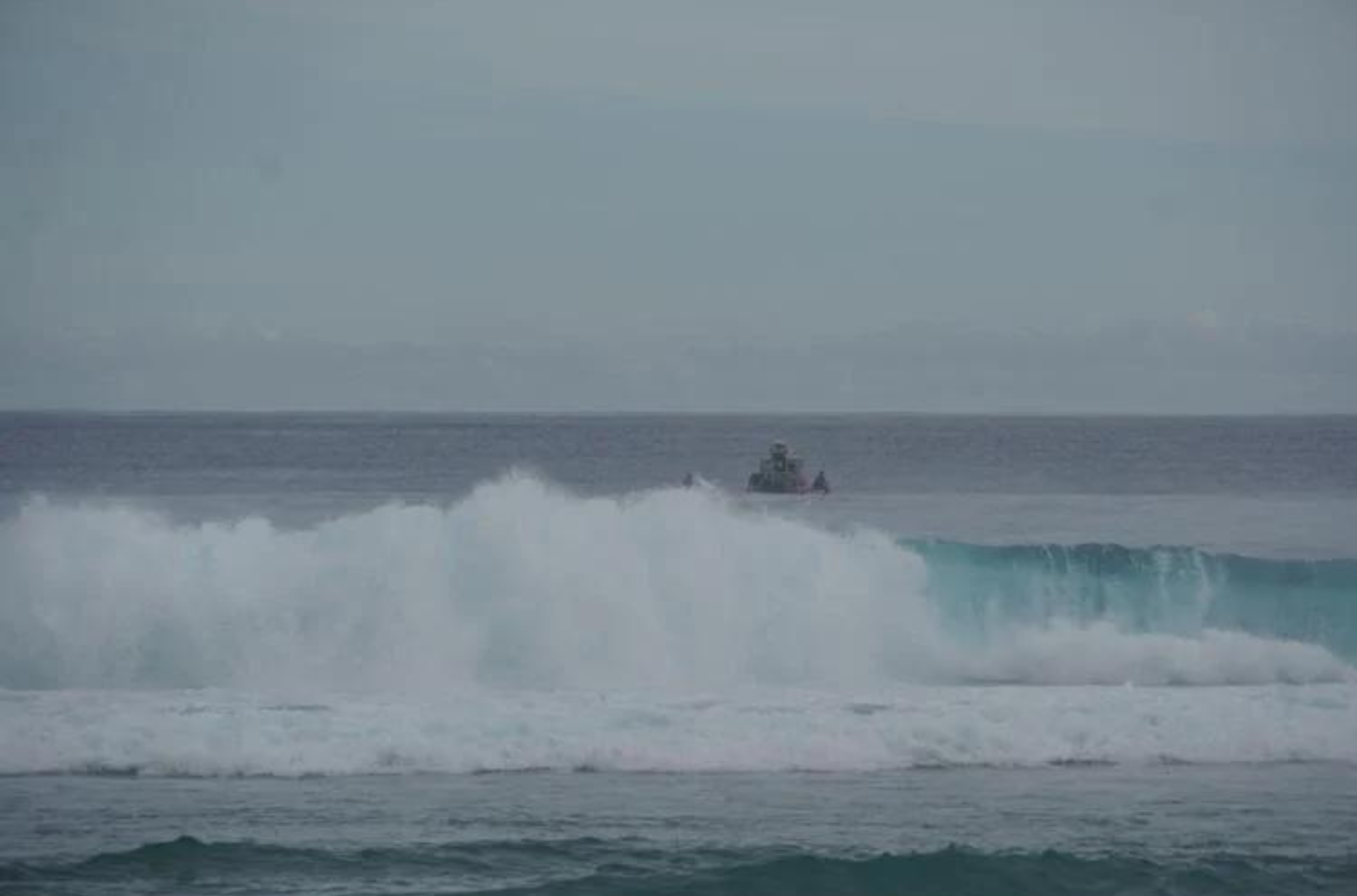 The search for a 50-year-old man who was reported to be a distressed swimmer on Sunday afternoon at Tanguisson Beach continued into Monday.