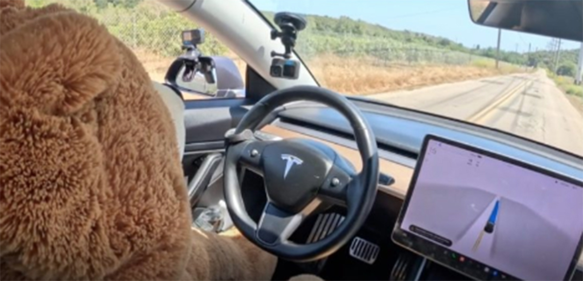 In a test drive on a private road, the Tesla driver monitoring system, meant to assure a human driver is paying attention to avoid crashes, fails to detect a giant teddy bear meant to mimic a person in the driverâ€™s seat. (The Dawn Project/AI Addict/TNS)