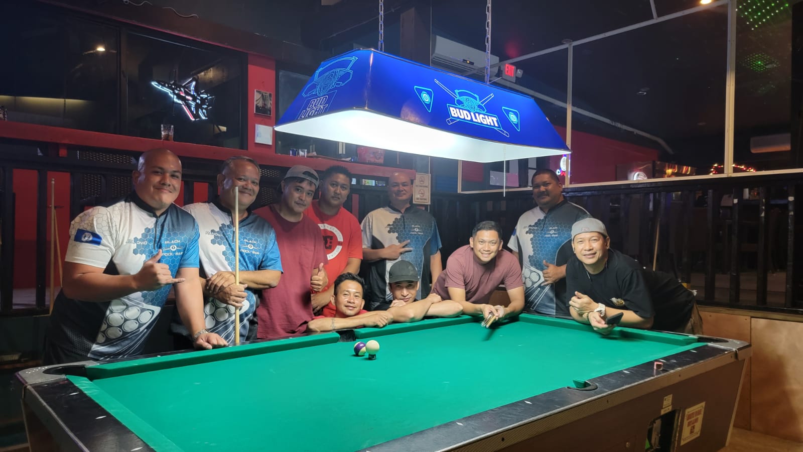 Black 8 Rack N Roll and Shooters pose together during Tuesday's game in the Tuesday division of the 2023 SBA Budweiser Open 8-Ball League held at the Black 8 Pool Bar. 