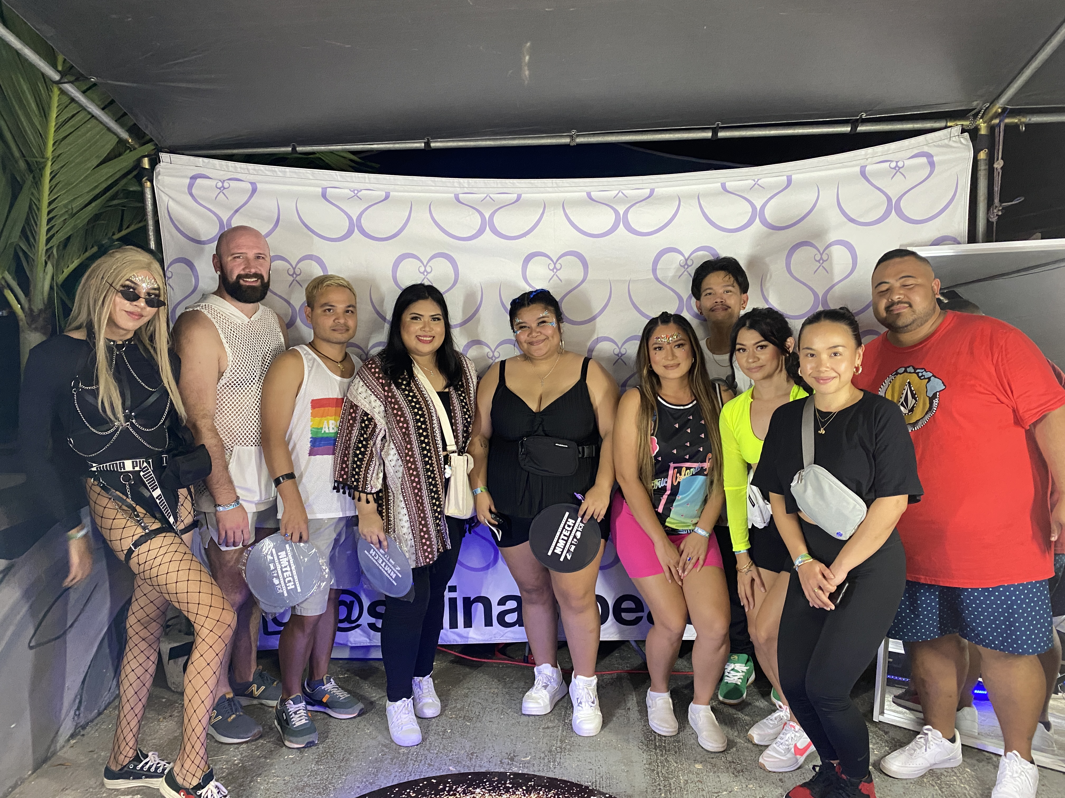 An NMTech Cosmetology cohort worked in partnership with Cinched by Salina's to apply body and hair art at EIF Saipan