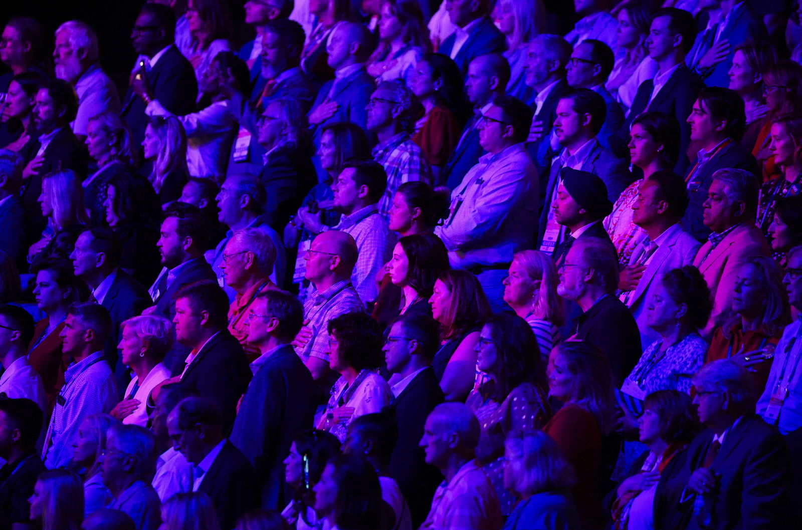 Debate attendees stand for the U.S. Pledge of Allegiance at the first Republican candidates' debate of the 2024 U.S. presidential campaign in Milwaukee, Wisconsin, U.S. August 23, 2023. REUTERS/Brian Snyder