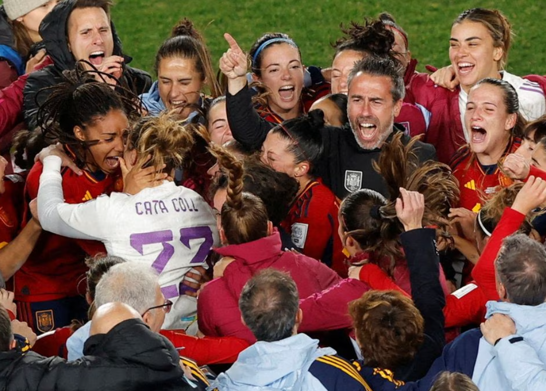 Spanish players and coach Jorge Vilda celebrate after beating Sweden to reach the final of the Women’s World Cup  at Eden Park, Auckland, New Zealand on Aug. 15, 2023.