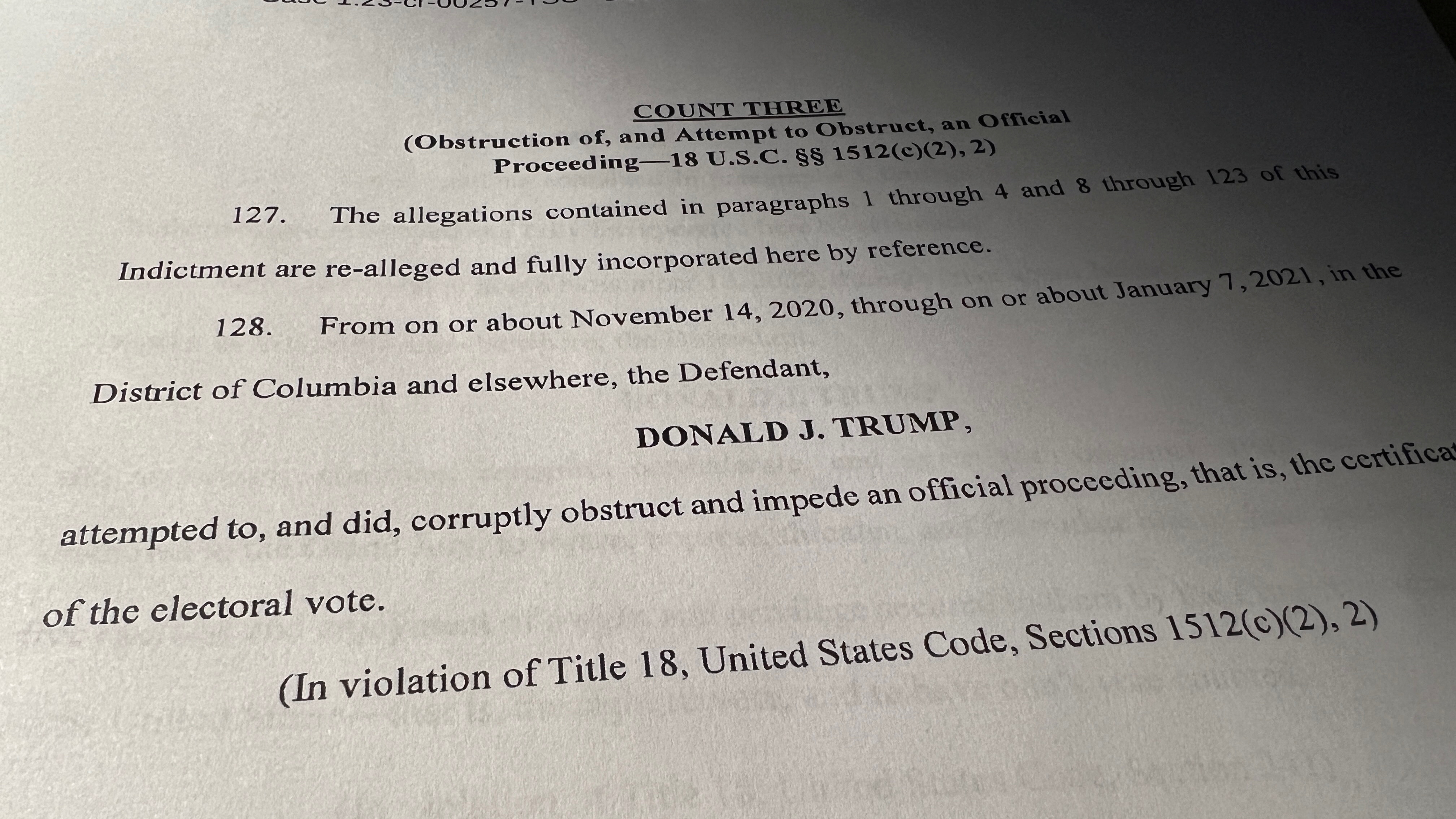 Count three of "obstruction of an official proceeding" of an indictment against former U.S. President Donald Trump is seen after he was hit with criminal charges for a third time in four months - this time arising from efforts to overturn his 2020 U.S. election defeat, in a photo illustration August 1, 2023. REUTERS/Kevin Fogarty/Photo Illustration
