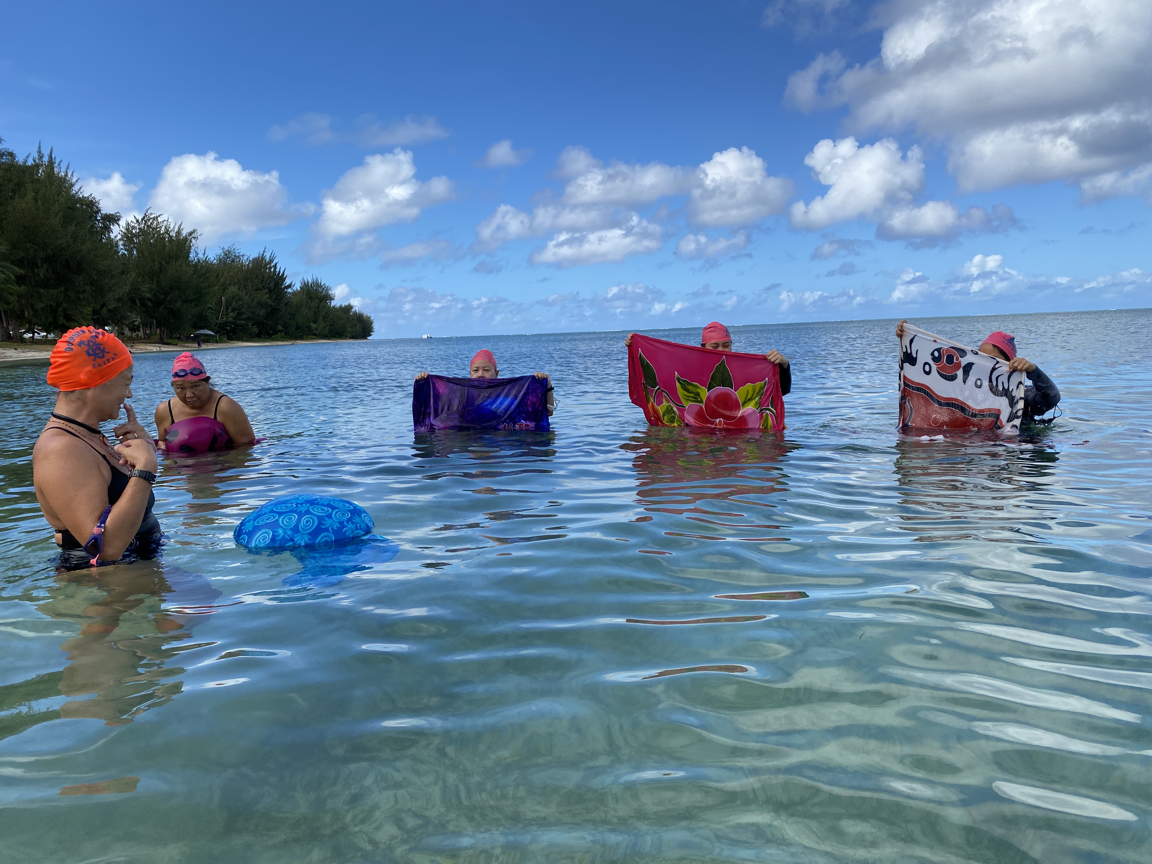 In this photo from February of this year, Andrea Carr teaches how to turn a lavalava into an improvised floatation device in the event of an emergency situation.