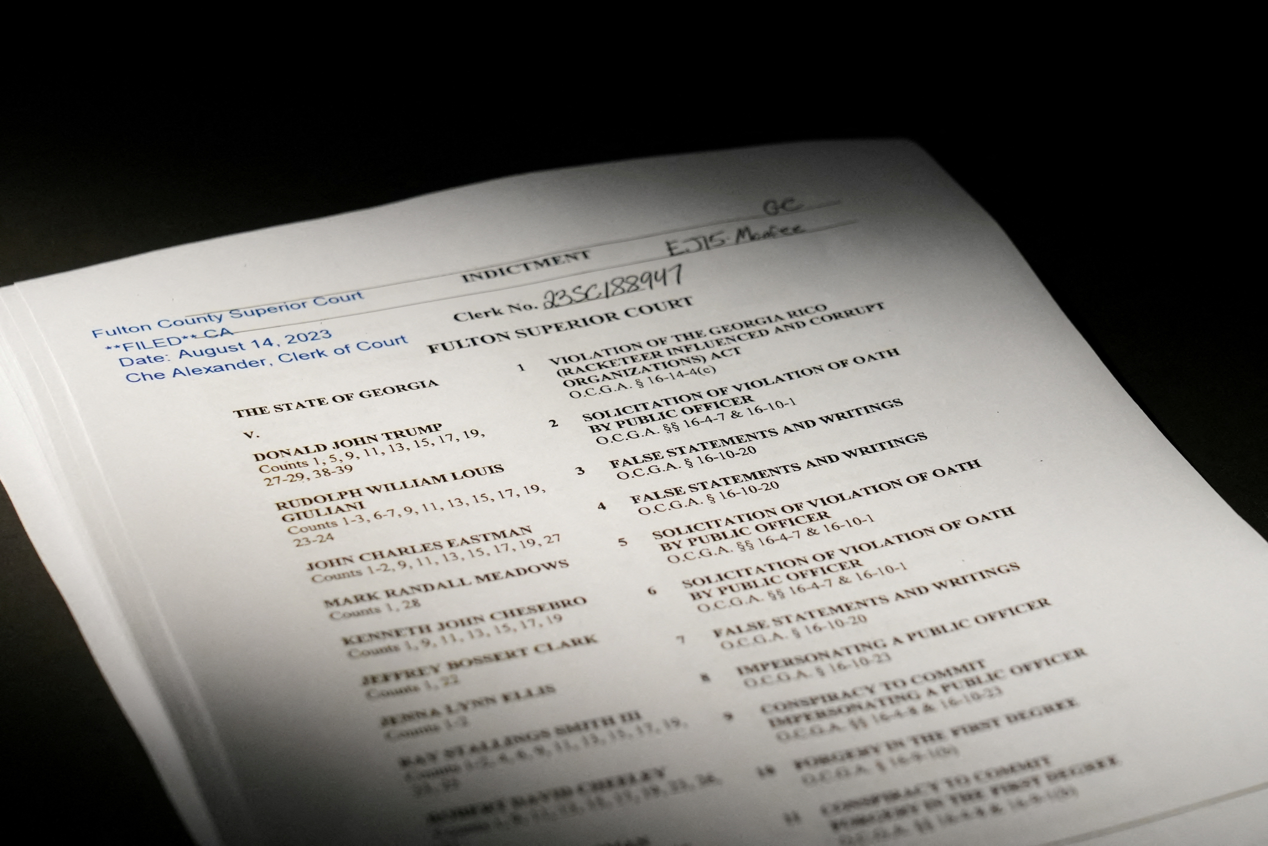 A view of the indictment, after a Georgia grand jury voted to indict former president Donald Trump with several felonies late Monday night in the case investigating attempts to overturn the results of the 2020 presidential election, is pictured at the Reuters Washington office, U.S. August 14, 2023. REUTERS/Julio-Cesar Chavez