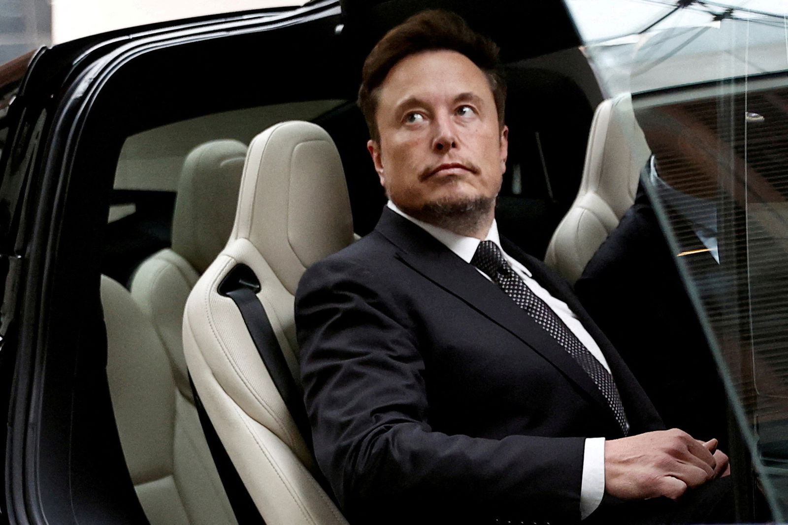 Tesla Chief Executive Officer Elon Musk gets in a Tesla car as he leaves a hotel in Beijing, China on May 31, 2023. 