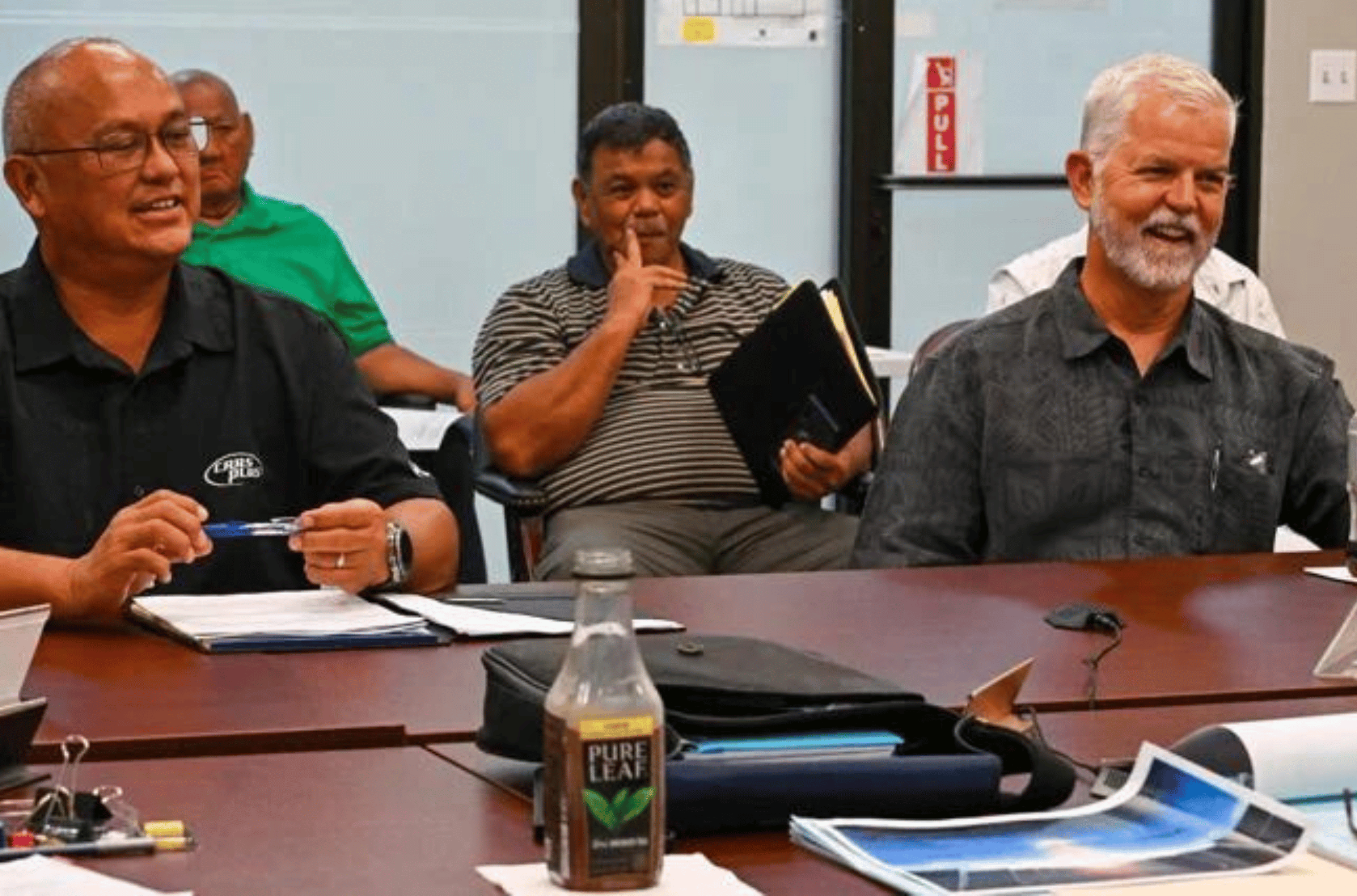 Joey Crisostomo, left front, and Jeff Jones, right front, from the Guam Racing Federation come before the Chamorro Land Trust Commission during the commission's monthly meeting Thursday, Aug. 17, 2023, at the ITC Building in Tamuning. 