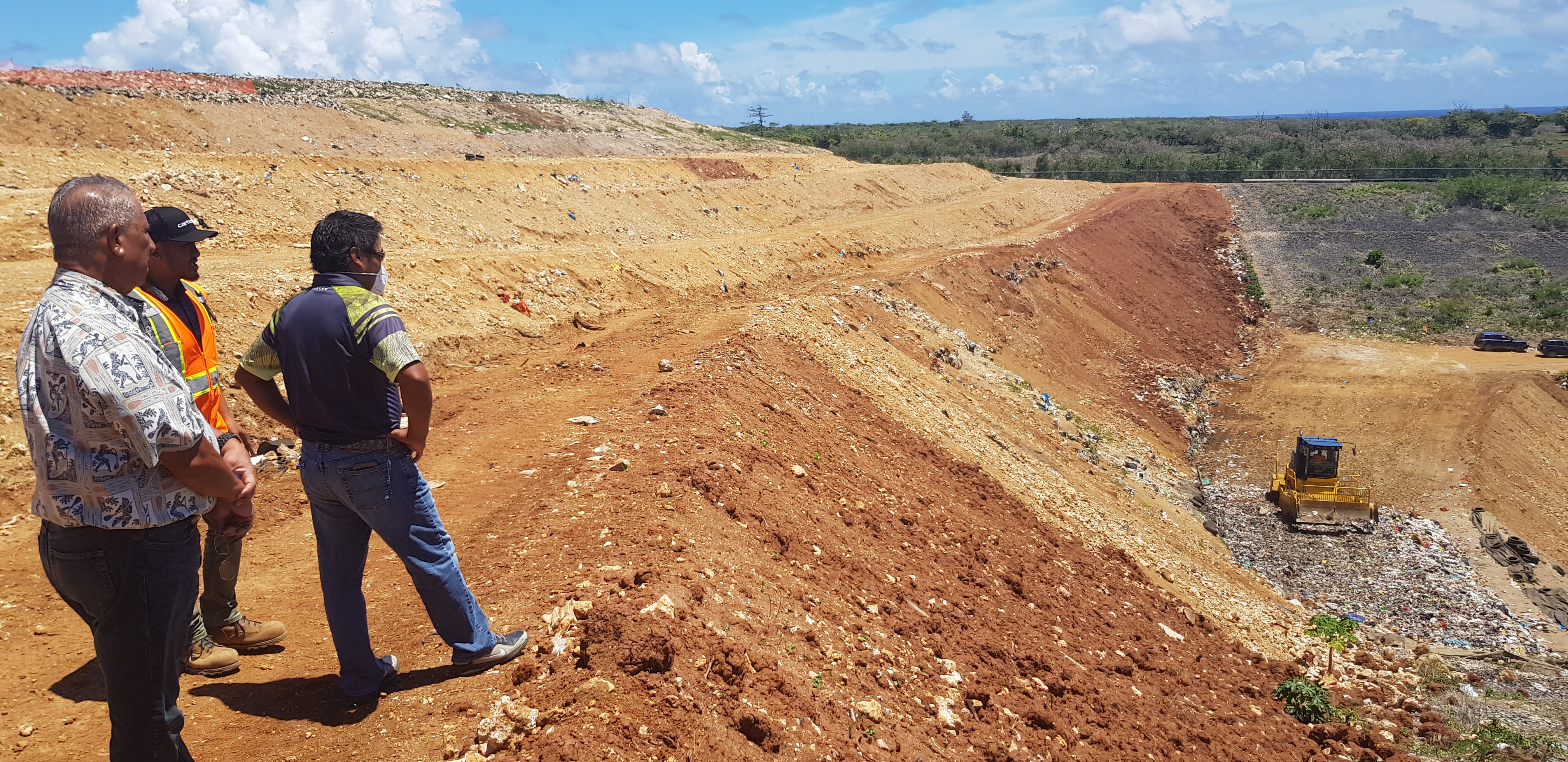 Micronesia Environment Services LLC's James Benavente, second left, with lawmakers at the Marpi landfill in Aug. 2020.