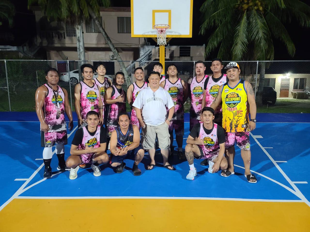 Checkpoint team members pose for a photo before their game against the Vik Team in the 2023 Saipan MagaLahi Eagles Club Invitational Basketball League at the Gualo Rai basketball court.