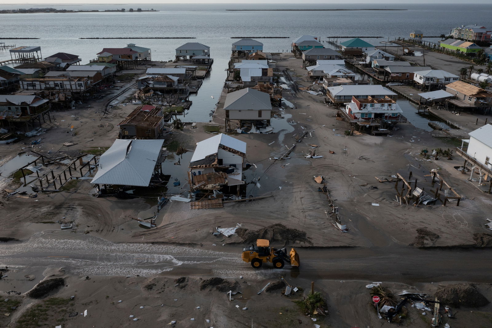 Houses and businesses are seen damaged in the aftermath of Hurricane Ida as the Category 4 hurricane devastated the town and barrier island of Grand Isle, Louisiana, U.S., September 2, 2021. Picture taken with a drone. REUTERS/Adrees Latif/File Photo