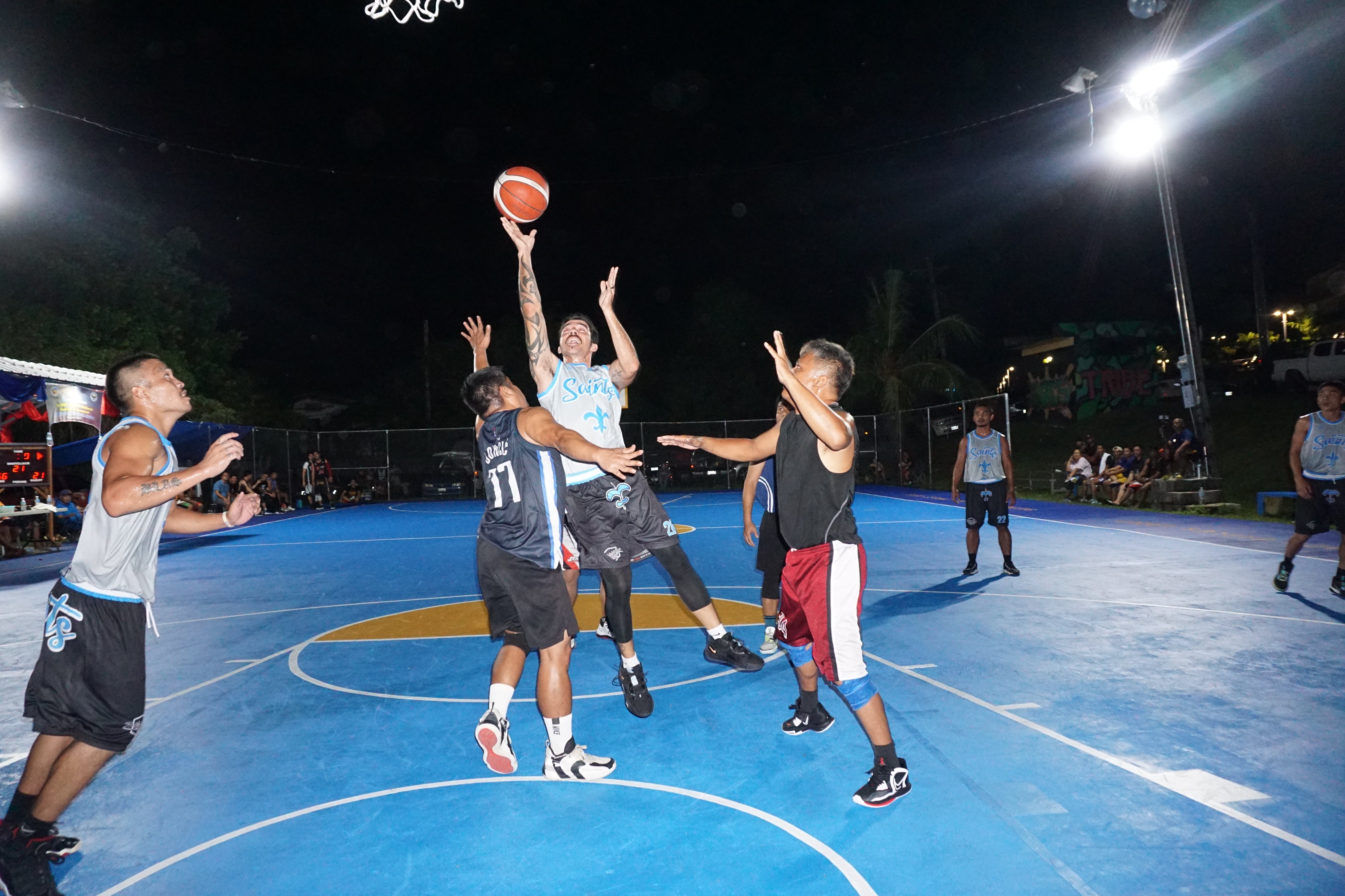 The CK Saints’ Don Brennan gets fouled as he goes up for the shot during an open division game of the 2023 Saipan MagaLahi Eagles Club Invitational Basketball League on Tuesday at the Gualo Rai basketball court.