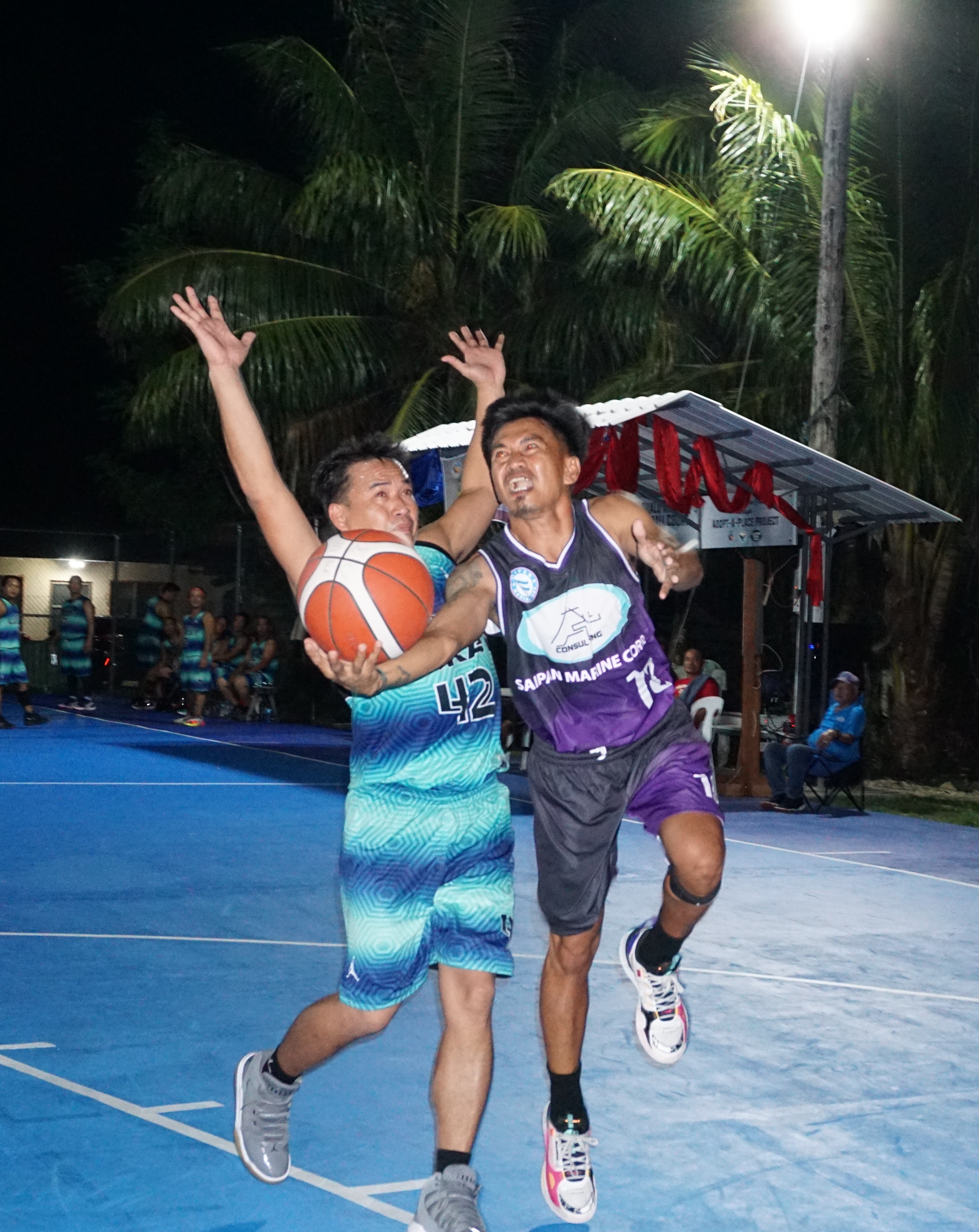 The A Plus Team's Joel Javier gets fouled as he extends for the finish during a masters division game of the 2023 Saipan MagaLahi Eagles Club Invitational Basketball League Thursday at the Gualo Rai basketball court.