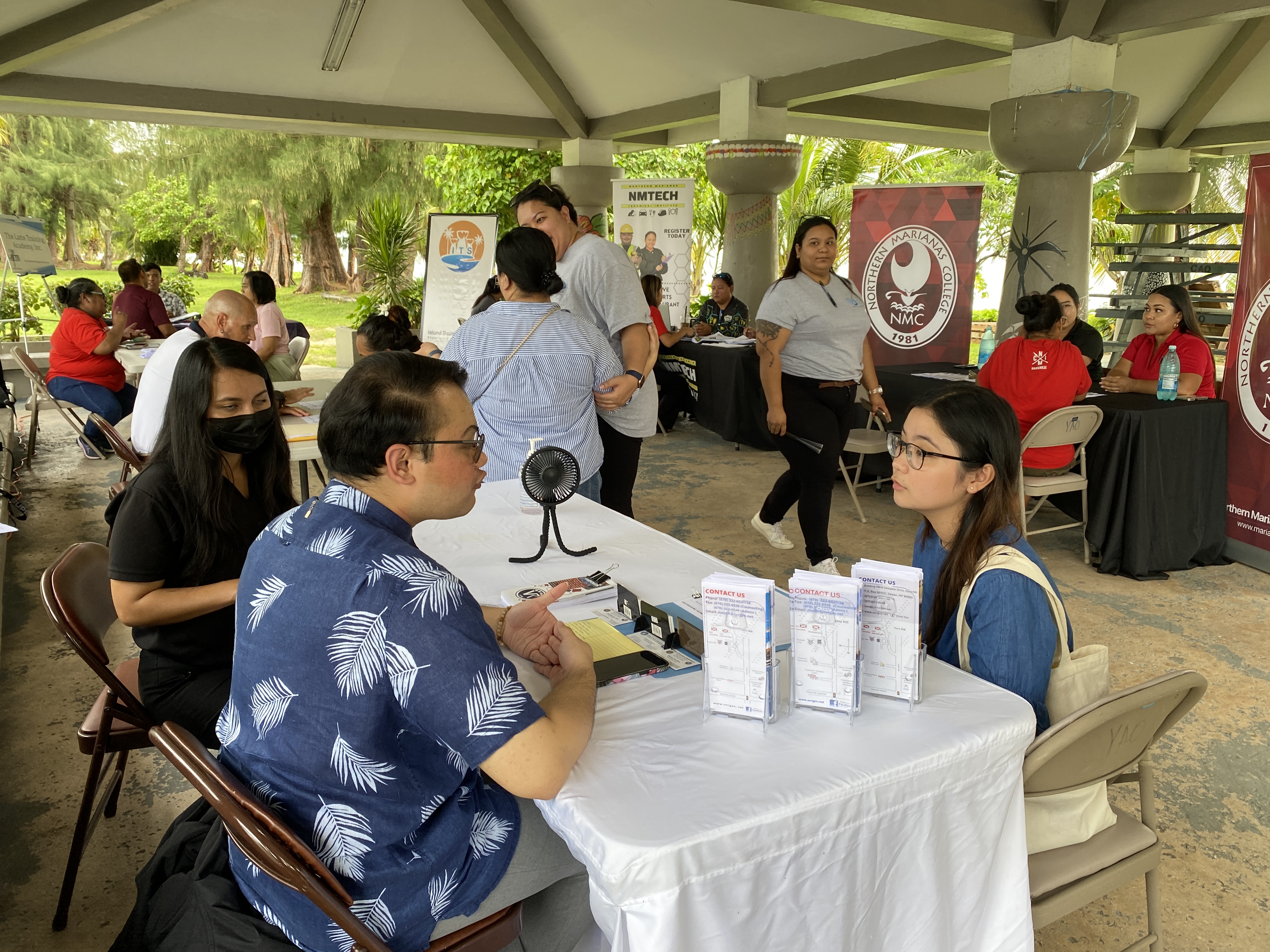 Community members attend the Skill Up Expo at the Carolinian Affairs Office on Tuesday to learn about the different training programs available to them.