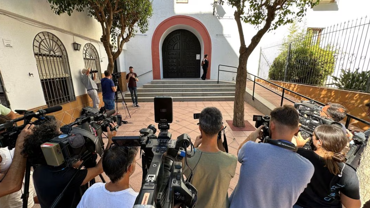 Media representatives are pictured outside a church in Motril where the mother of Royal Spanish Football Federation Luis Rubiales, Angeles Bejar is on hunger strike on Aug. 28, 2023.