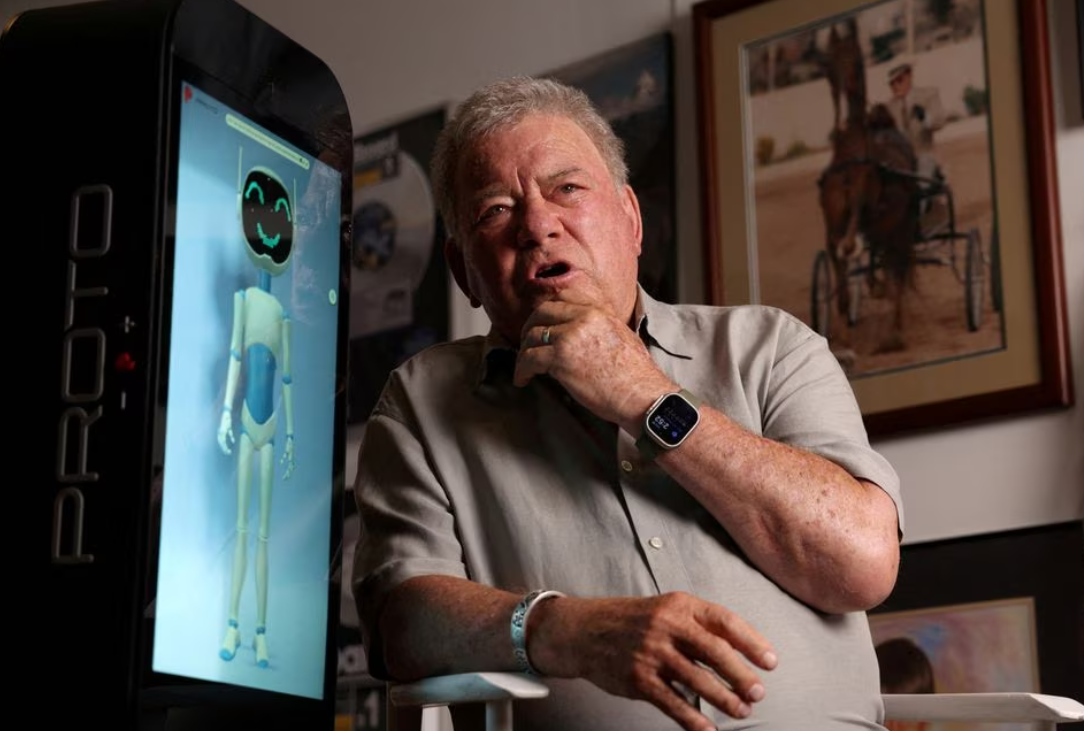 Actor William Shatner interacts and talks with a Proto M AI (Artificial Intelligence) unit at his office in Studio City, California, Aug. 17, 2023.