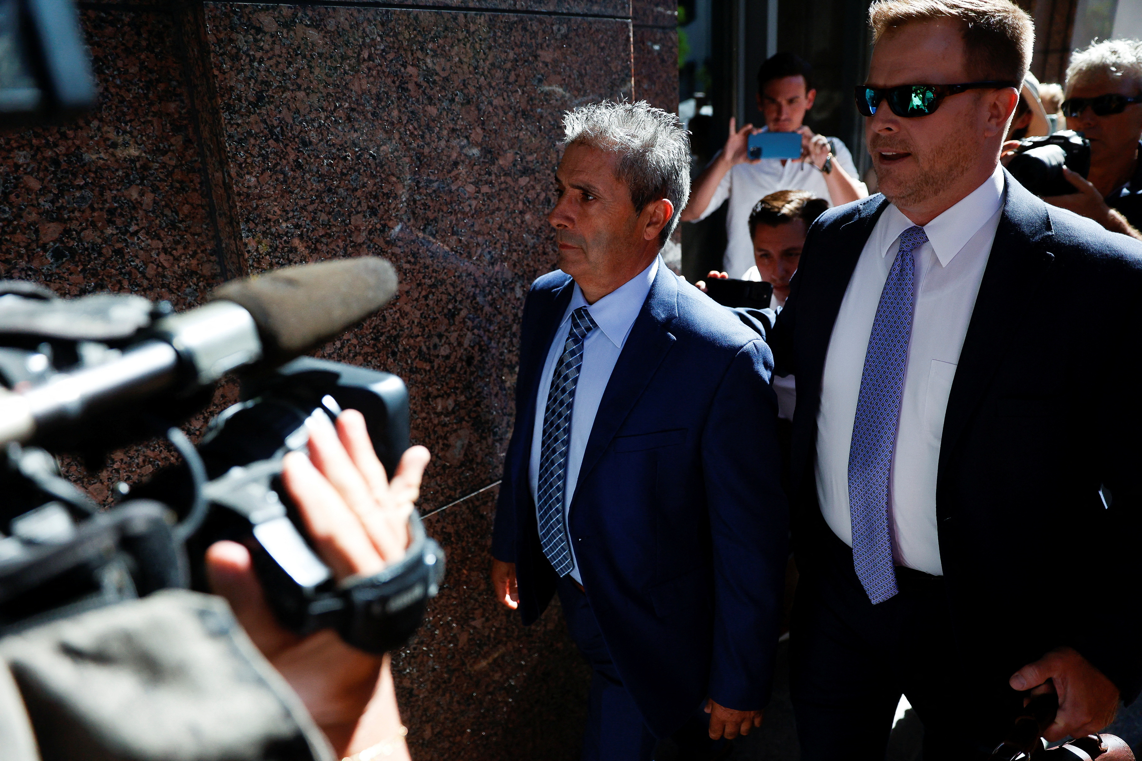 Carlos De Oliveira, the property manager of former U.S. President Donald Trump's Mar-a-Lago estate, arrives at federal court to face charges related to Trump's retention of classified documents at his Florida resort home, in Miami, Florida, U.S. July 31, 2023. REUTERS/Marco Bello