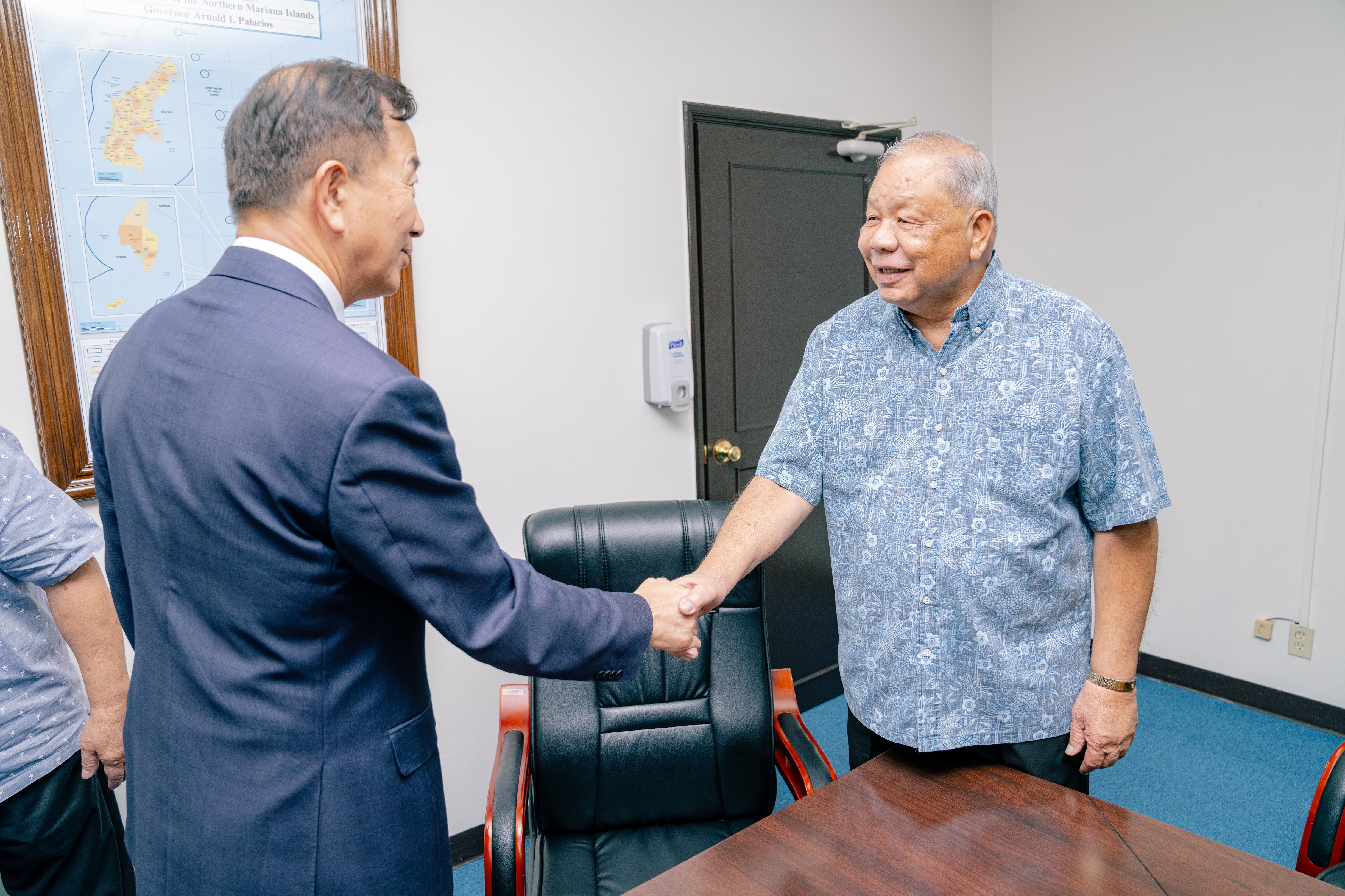 Lt. Gov.  David M. Apatang shakes hands with Lee Seo Young, the Korean consul general based in Hawaii.