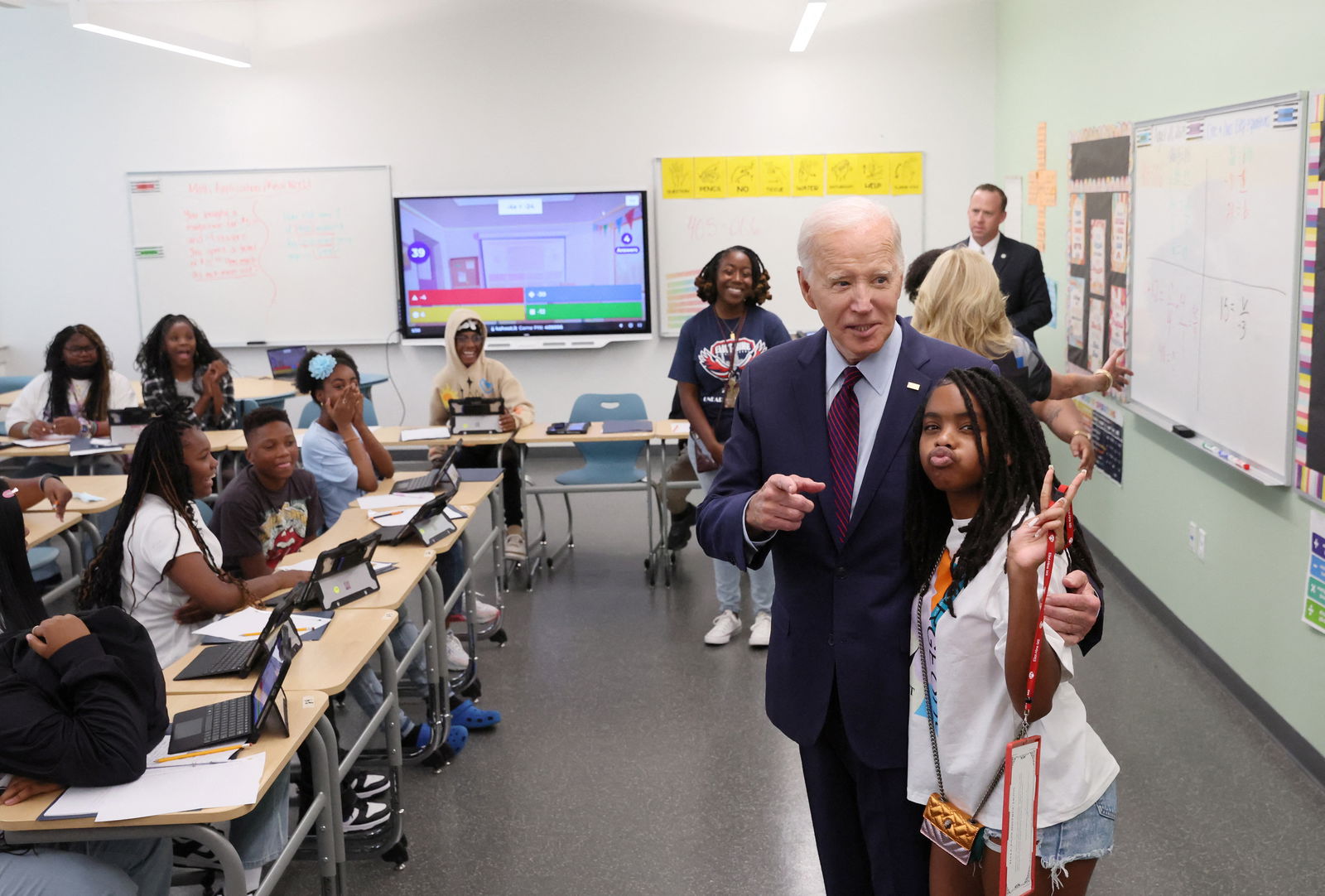 U.S. President Joe Biden greets a student on their first day back to school at Eliot-Hine Middle School in Washington, U.S., August 28, 2023. REUTERS/Leah Millis