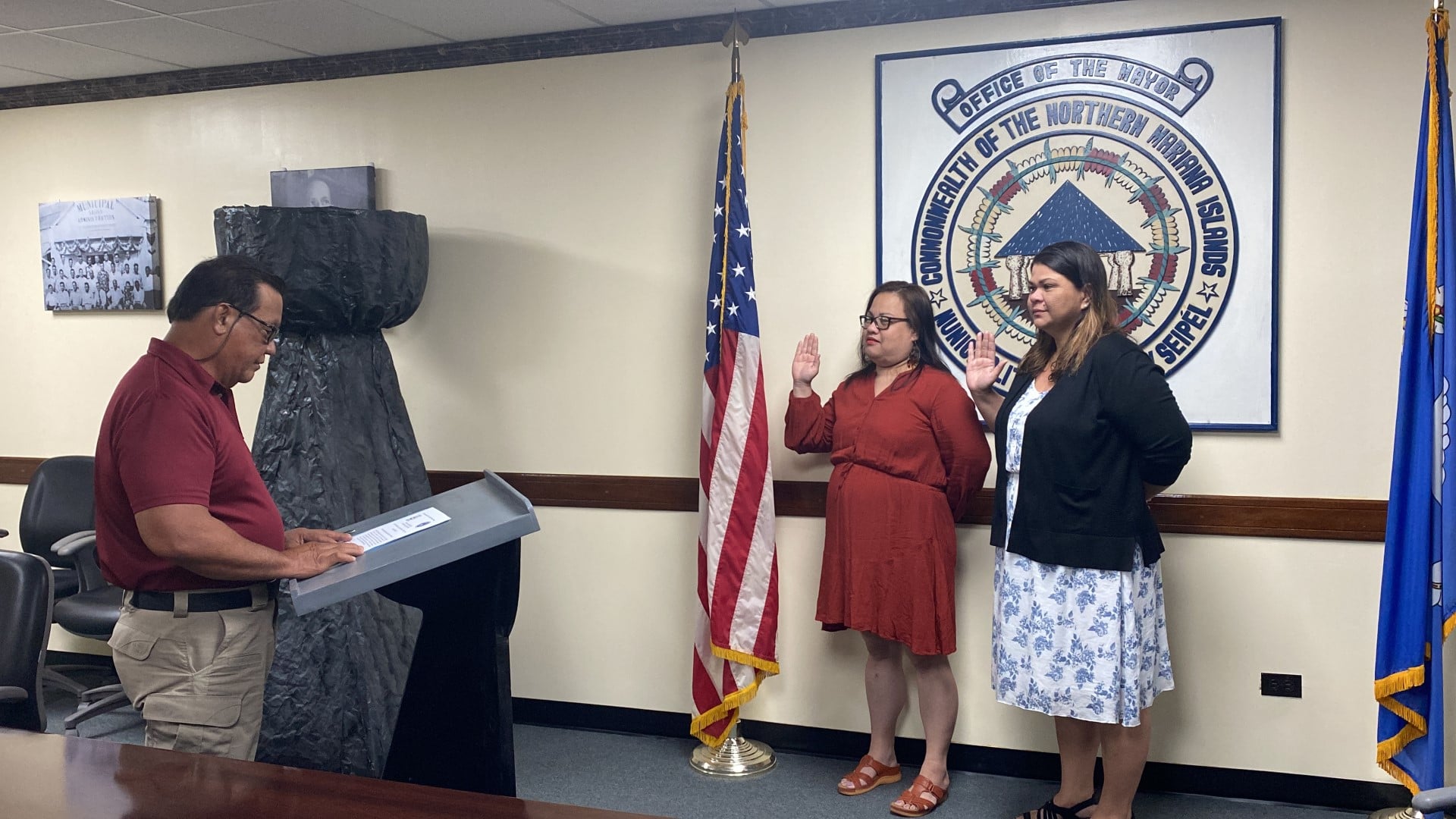 Saipan Mayor RB Camacho, left, swears in Flo Calvo and Eluene Baza as new board members of the Saipan Higher Education Financial Assistance  program on Tuesday, Aug. 1.