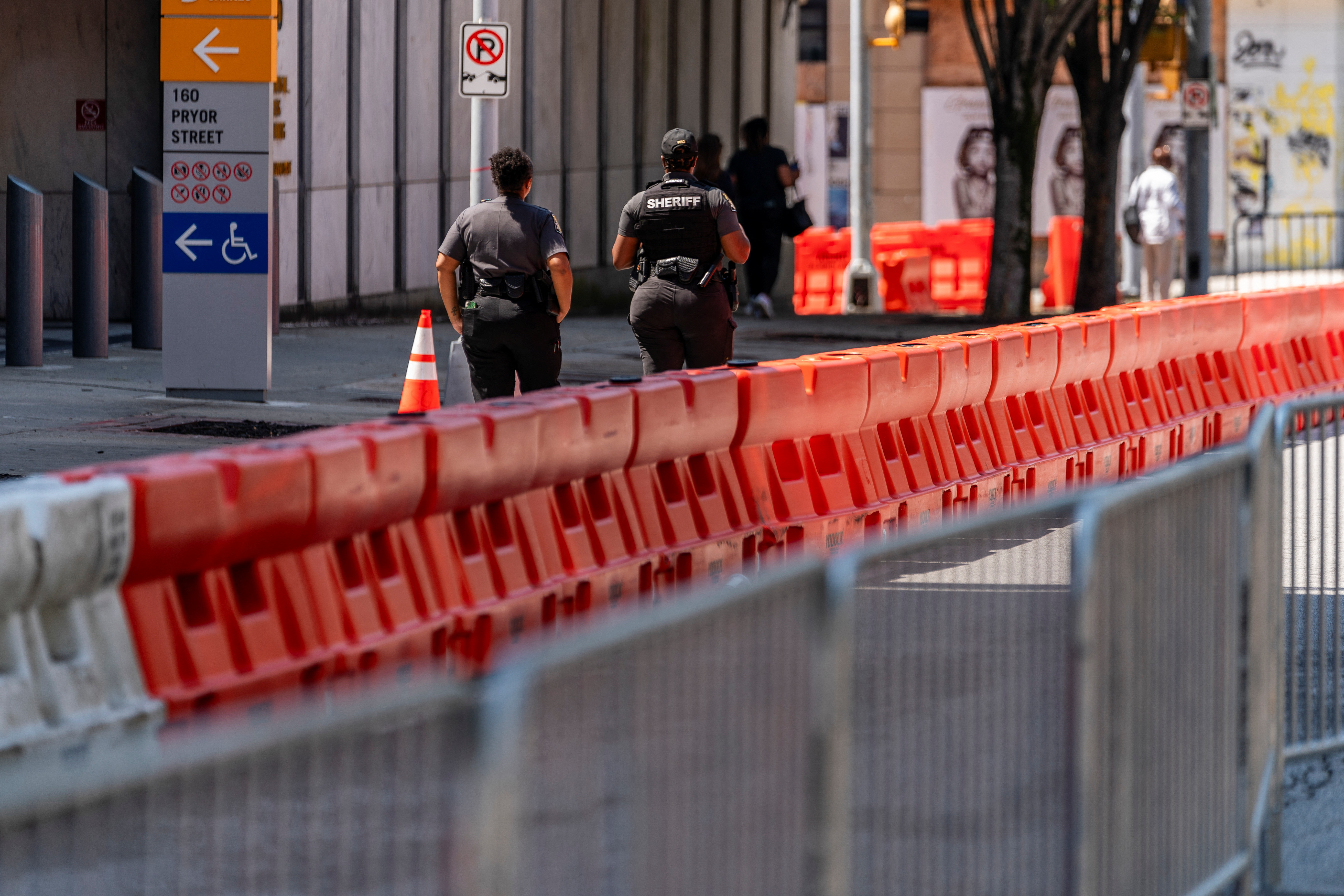 Security barriers are seen after the Fulton County Sheriff ordered roads to be closed as officials tighten security around the Lewis R. Slaton Courthouse, as the city prepares for a possible criminal indictment of former U.S. President Donald Trump for his attempts to overturn his election defeat in the state, in Atlanta, Georgia, U.S. August 7, 2023. REUTERS/Elijah Nouvelage