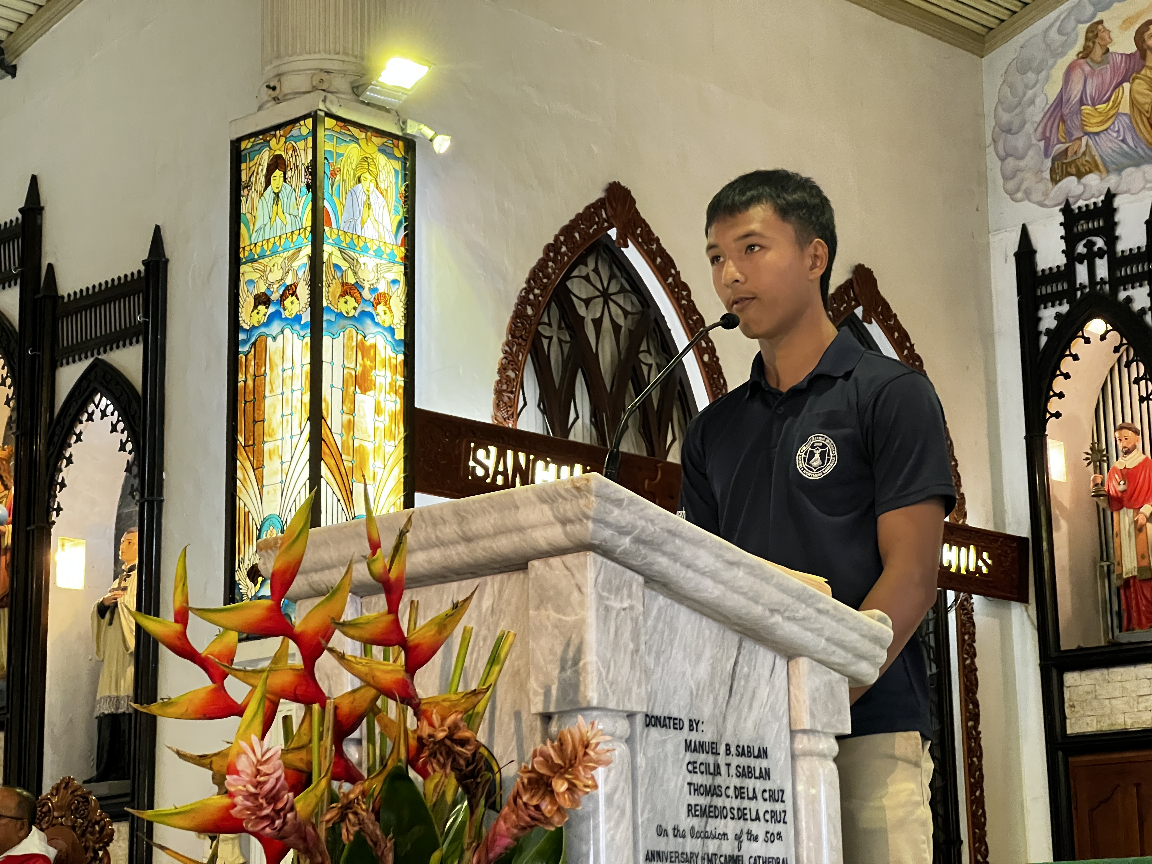 MCS Student Council Vice President Ruben Guerrero recites the Universal Prayers.