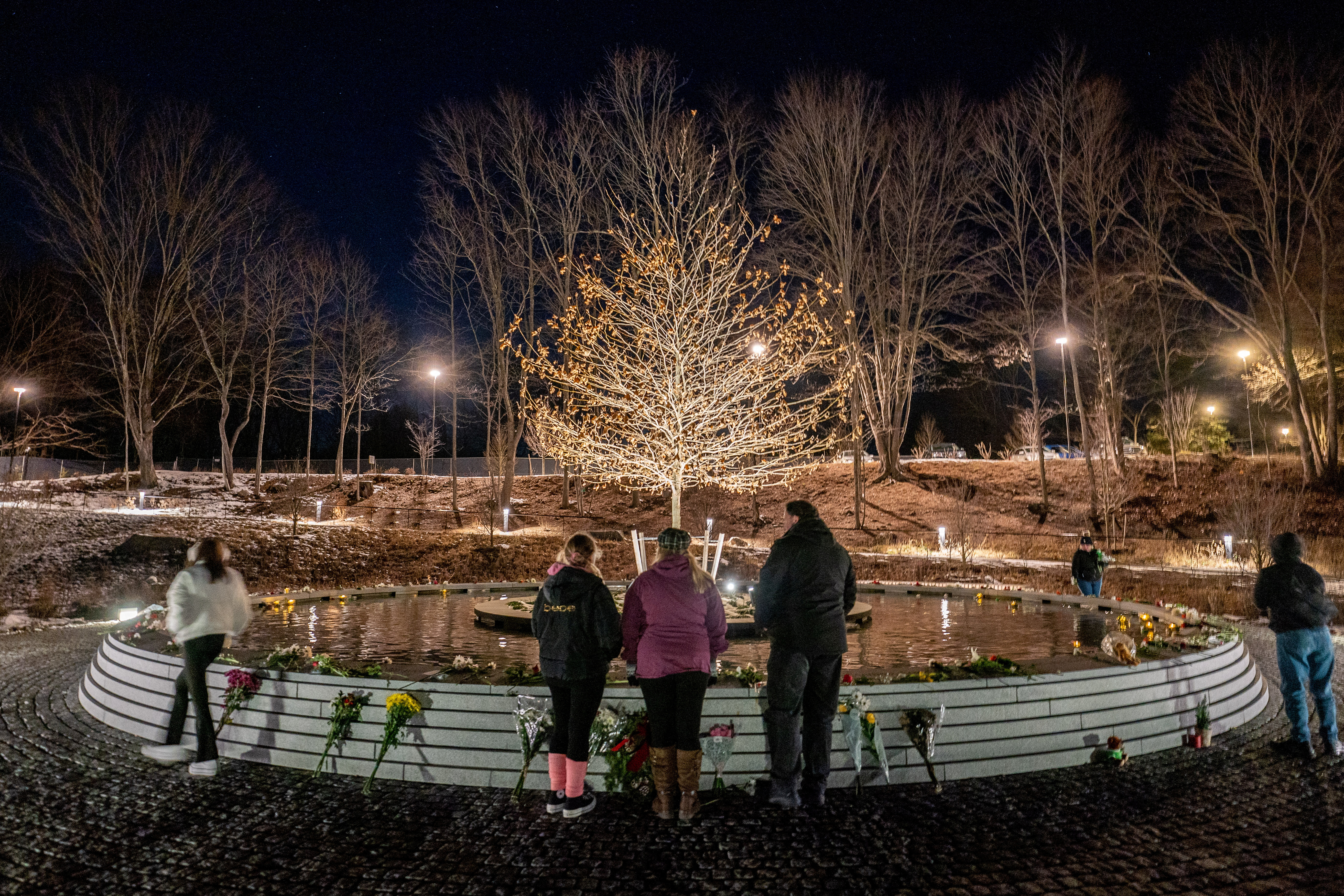 People visit the Sandy Hook Permanent Memorial on the 10th anniversary of the shooting at Sandy Hook Elementary School in Newtown, Connecticut, U.S., December 14, 2022. REUTERS/David 'Dee' Delgado/File Photo