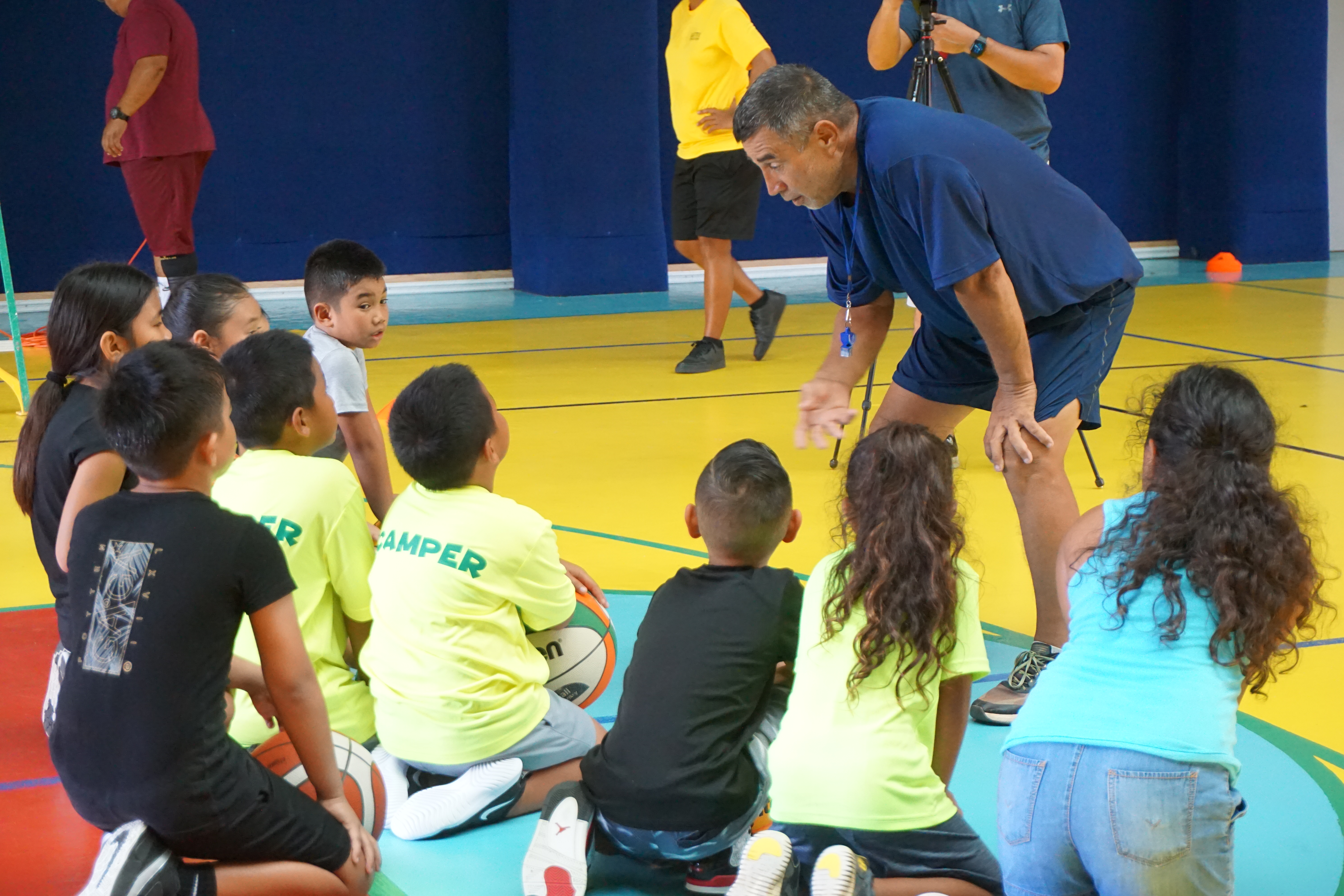 Instructor Elias Rangamar talks to the youth participants of the Taga Hoops program conducted by the Kultura Basketball Academy on Saturday at the Agape Christian School gym.