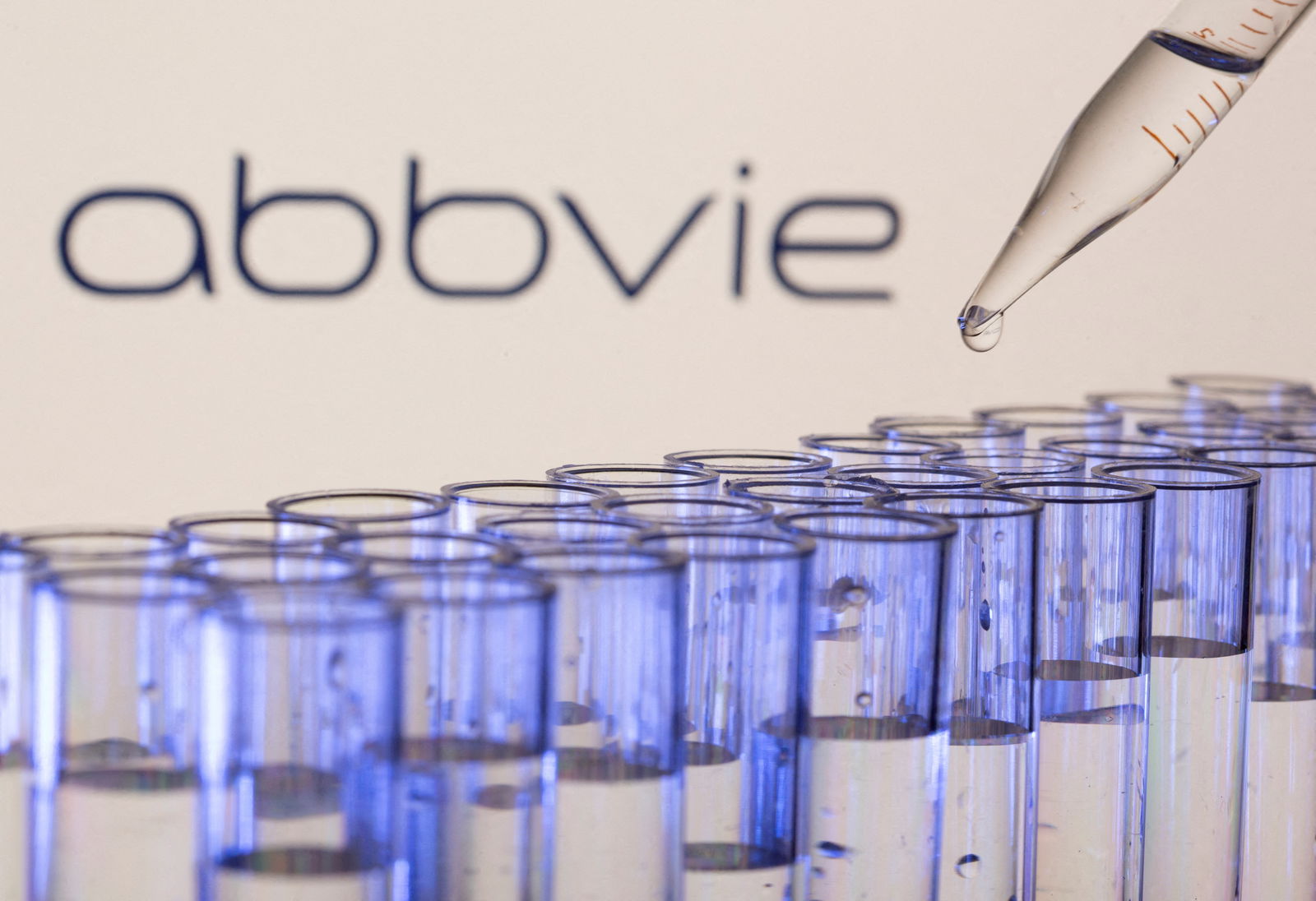Test tubes are seen in front of a displayed Abbvie logo in this illustration taken, May 21, 2021. REUTERS/Dado Ruvic/Illustration/File Photo