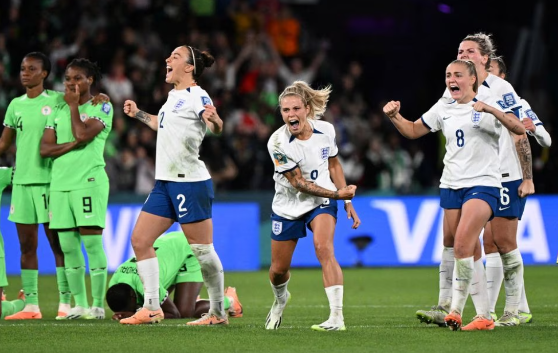 England's Rachel Daly and Georgia Stanway celebrate during the penalty shootout against Nigeria at Brisbane Football Stadium, in Brisbane, Australia, Aug. 7, 2023.