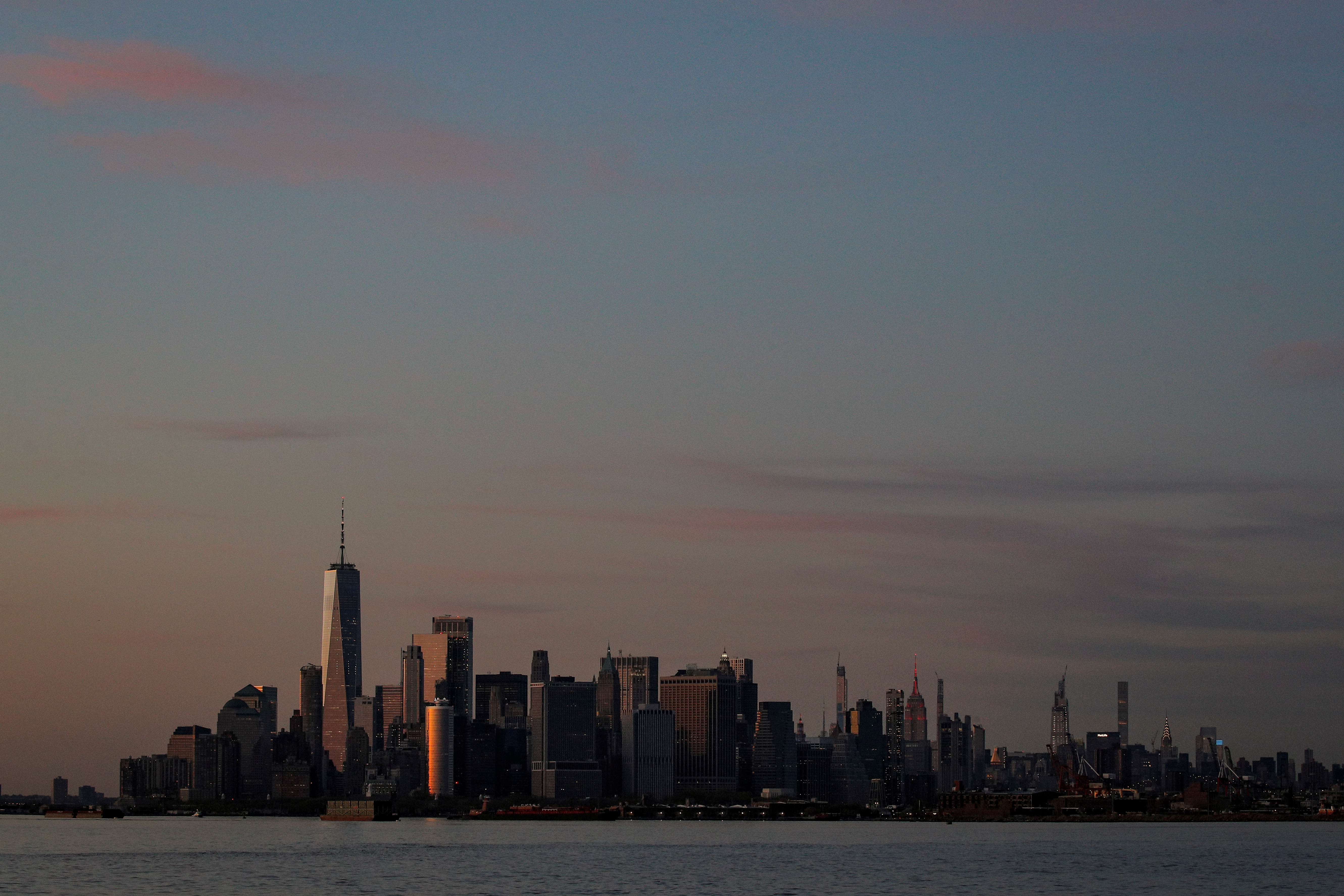 The Manhattan skyline is seen during sunset from the Brooklyn borough of New York City, during the outbreak of the coronavirus disease (COVID-19), U.S., April 20, 2020. REUTERS/Brendan McDermid/FILE PHOTO