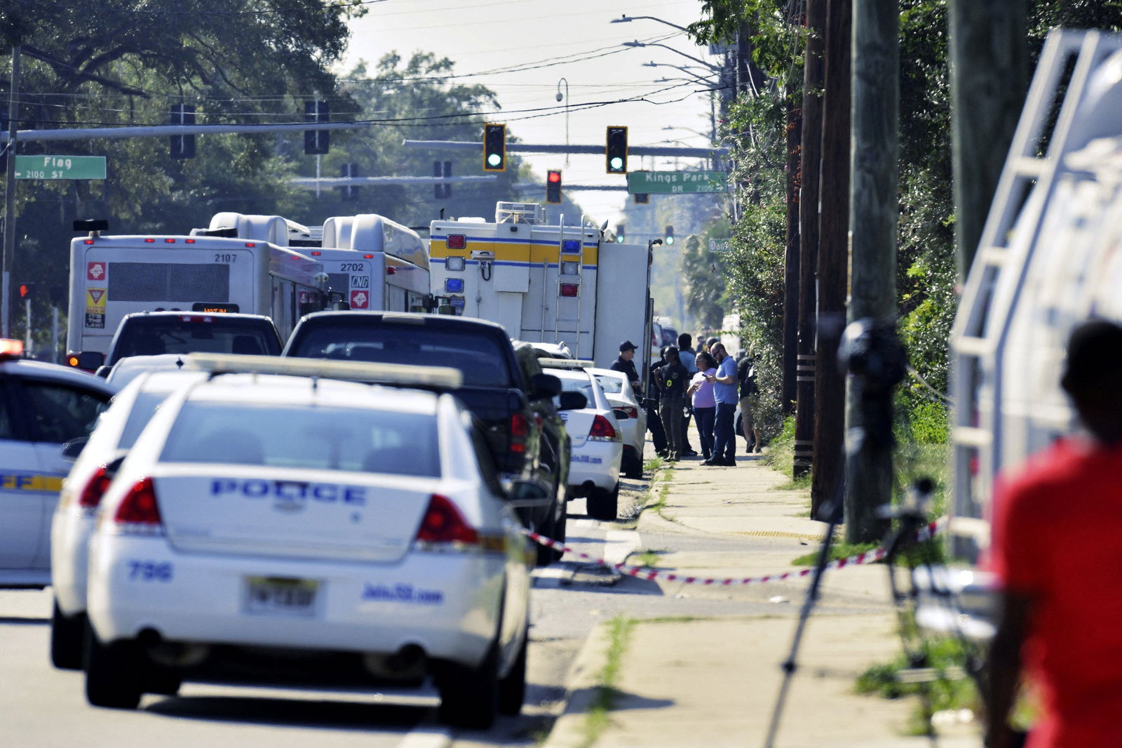 Emergency personnel surround a Dollar General store after a white man armed with a high-powered rifle and a handgun killed three Black people before shooting himself, in what local law enforcement described as a racially motivated crime in Jacksonville, Florida, U.S. August 26, 2023. Bob Self/USA Today Network via REUTERS.