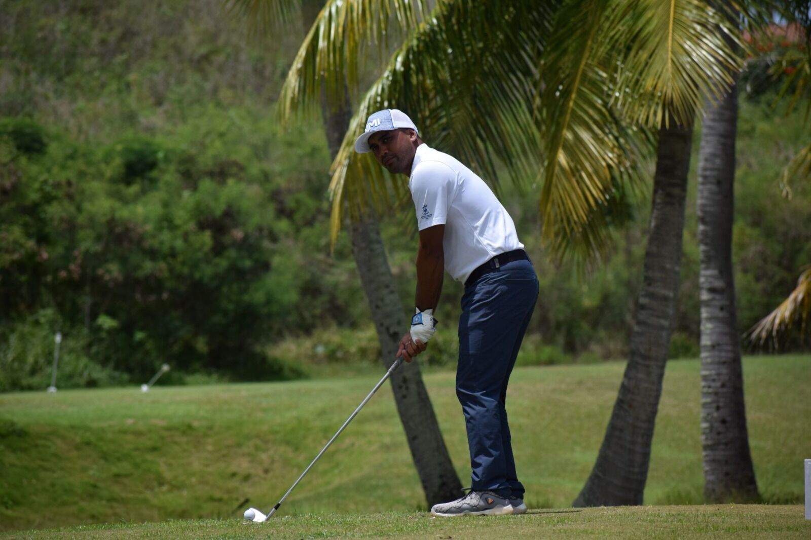 Franco Santos lines up for a shot during the Pacific Mini Games 2022 at the Coral Ocean Resort Saipan golf course.