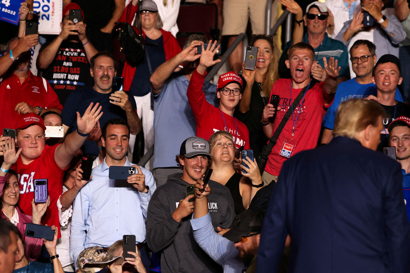 Attendees react as former U.S. President and Republican presidential candidate Donald Trump holds a campaign rally in Erie, Pennsylvania, U.S., July 29, 2023. REUTERS/Lindsay DeDario/File Photo