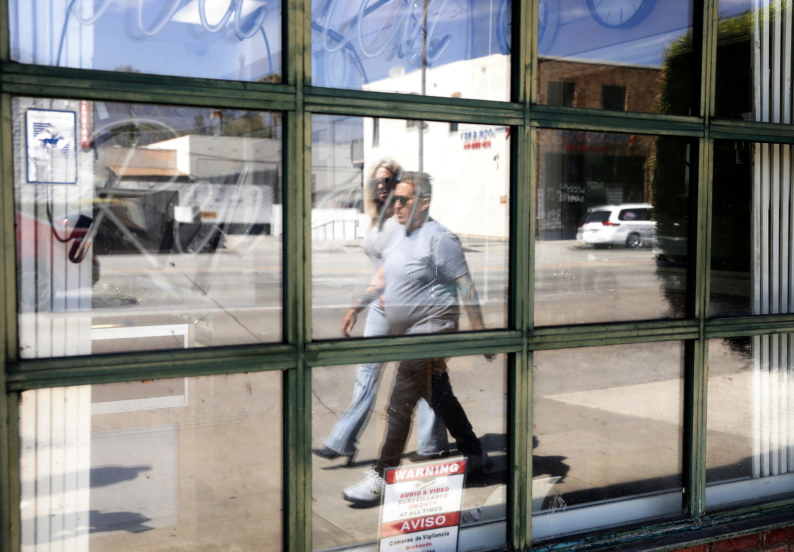 Crisis interventionist Vicki Lucas, front, is accompanied by Elisa Saunders, as they walk the streets of Pasadena, California, in search of Sherry Hillâ€™s daughter, on July 21, 2023. (Christina House/Los Angeles Times/TNS)