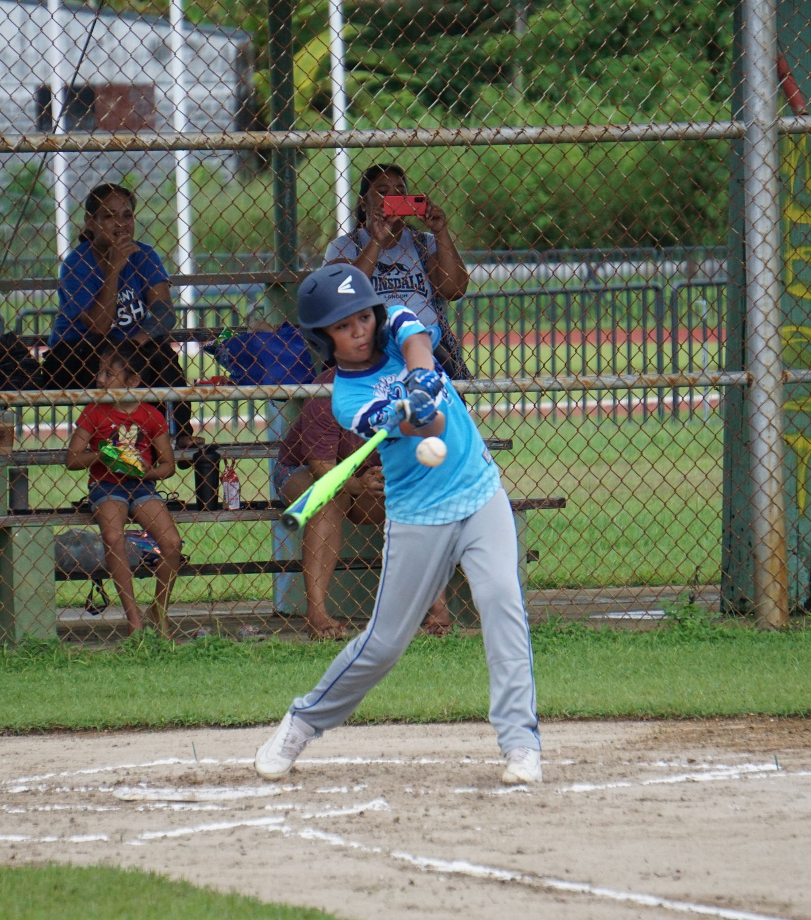 The Little Cubs' Daniel Camacho connects a hit during a Saipan Baseball League U12 Tournament game Saturday at the Miguel "Tan Ge" Pangelinan Baseball Field.