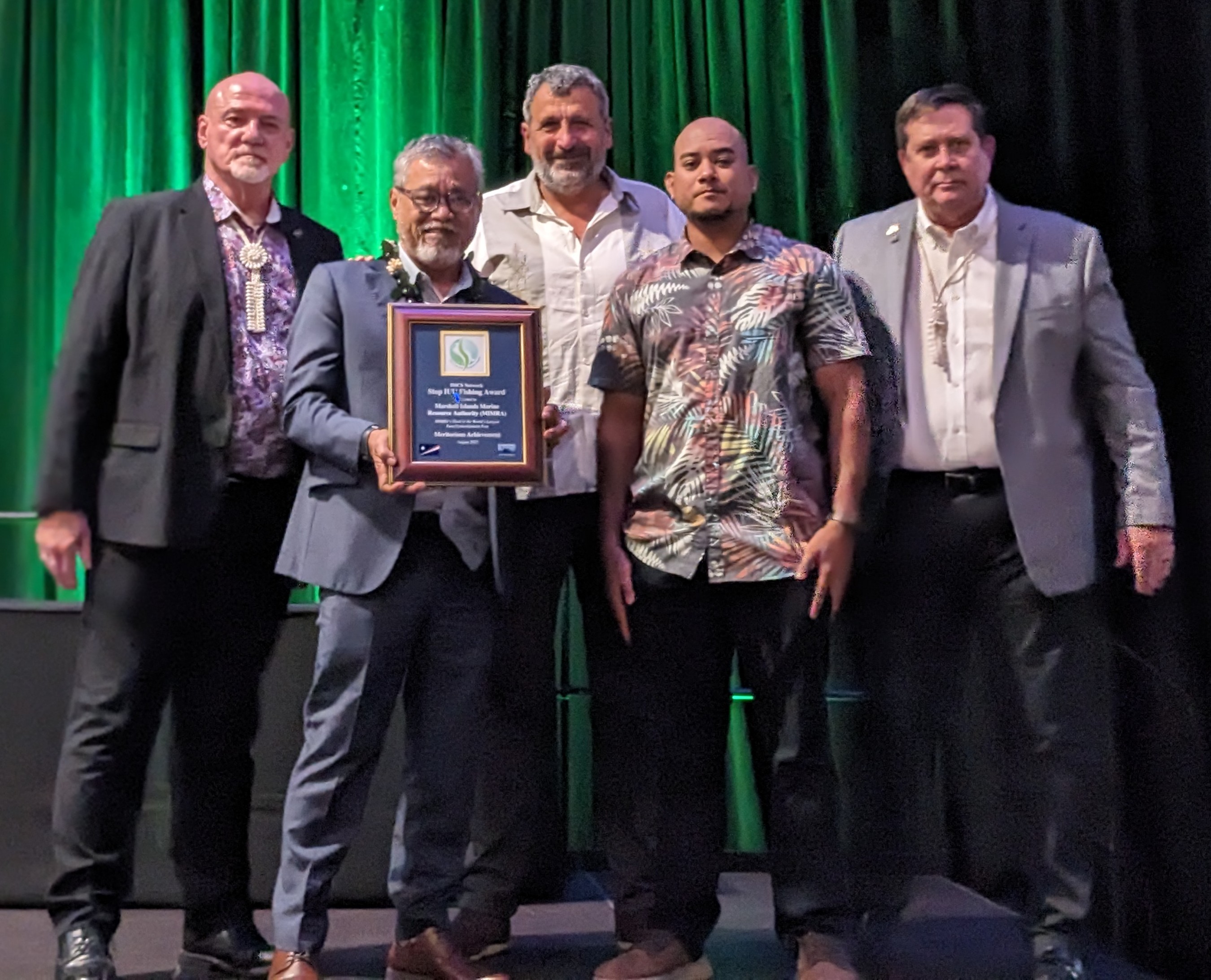 With officials from the International Fisheries Monitoring, Control and Surveillance Network on either side, Marshall Islands Marine Resources Authority Director Glen Joseph, New Zealand Ministry of Foreign Affairs and Trade Fisheries Advisor Francisco Blaha, and Oceanic Division Chief Fisheries Officer Beau Bigler receive the award for the authority’s work to prevent illegal fishing during a ceremony at a fisheries meeting in Halifax, Canada last week.
