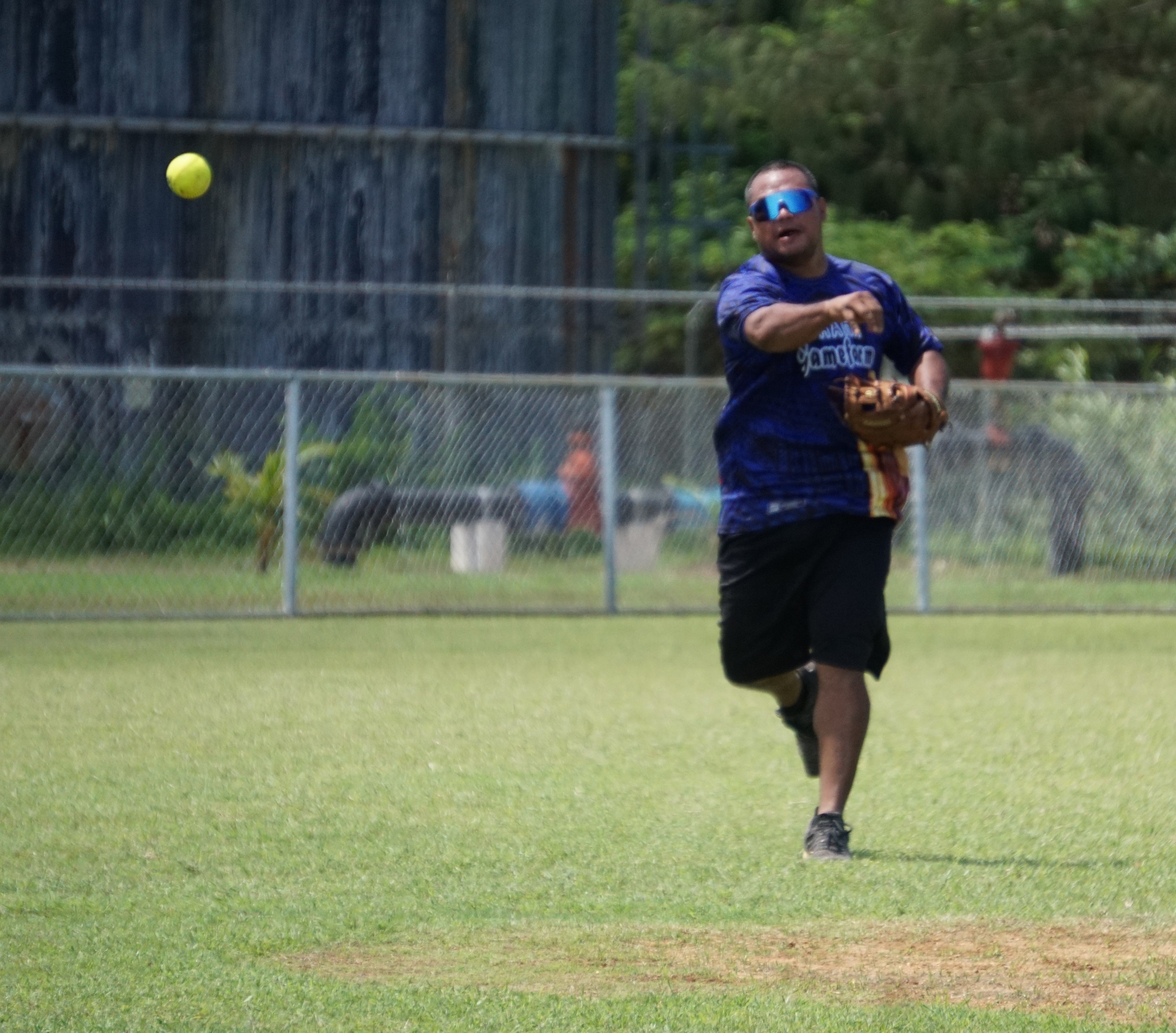 Dat's It shortstop JD Dikito throws to first base for the out during a game of the 2023 Budweiser Belau Amateur Softball Association Open League on Sunday at the Dandan baseball field.
