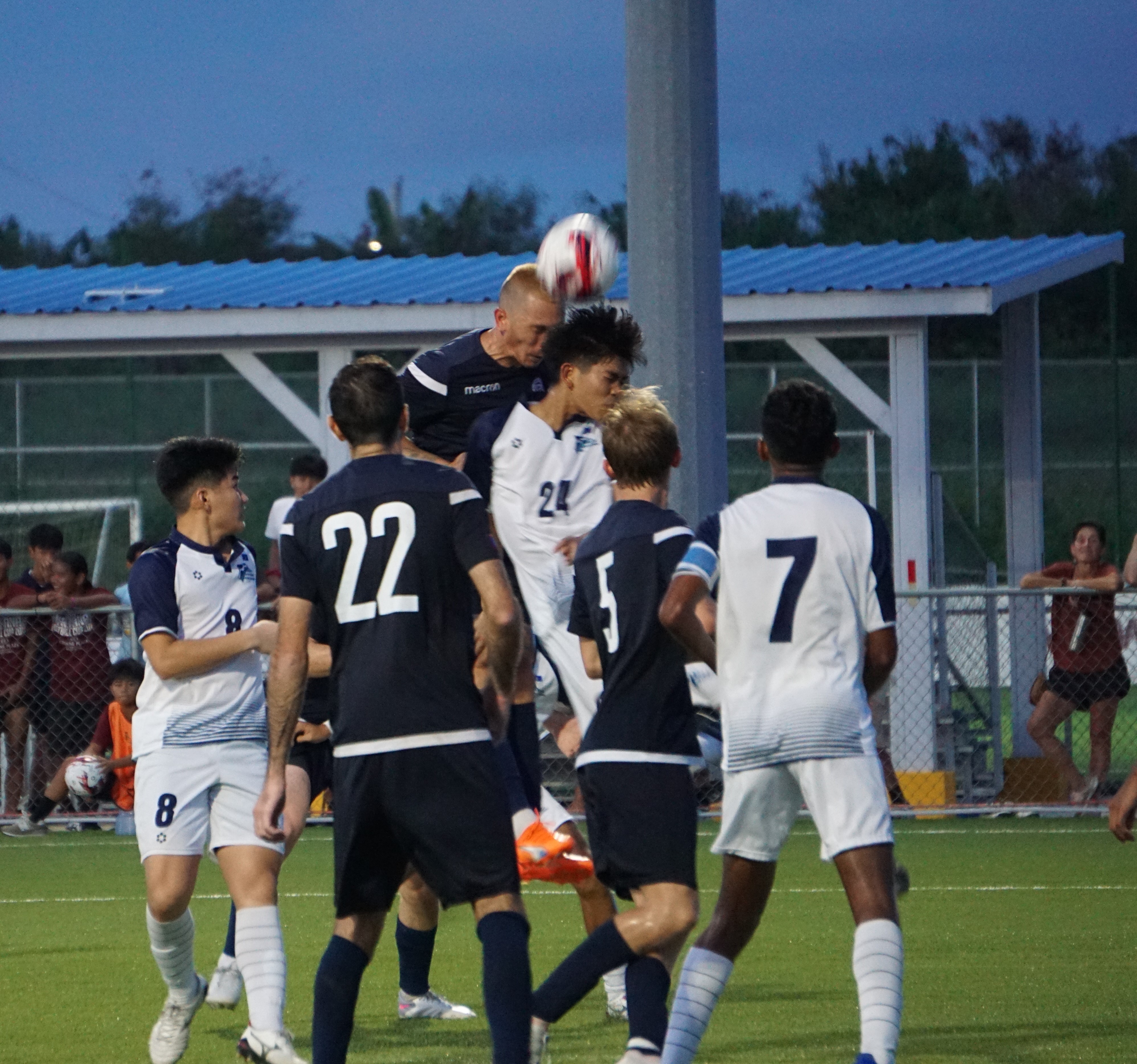 The NMI's Cody Shimizu clashes with a Guam player during a header attempt in a Marianas Football Cup  game Saturday at the NMI Soccer Training Center in Koblerville.
