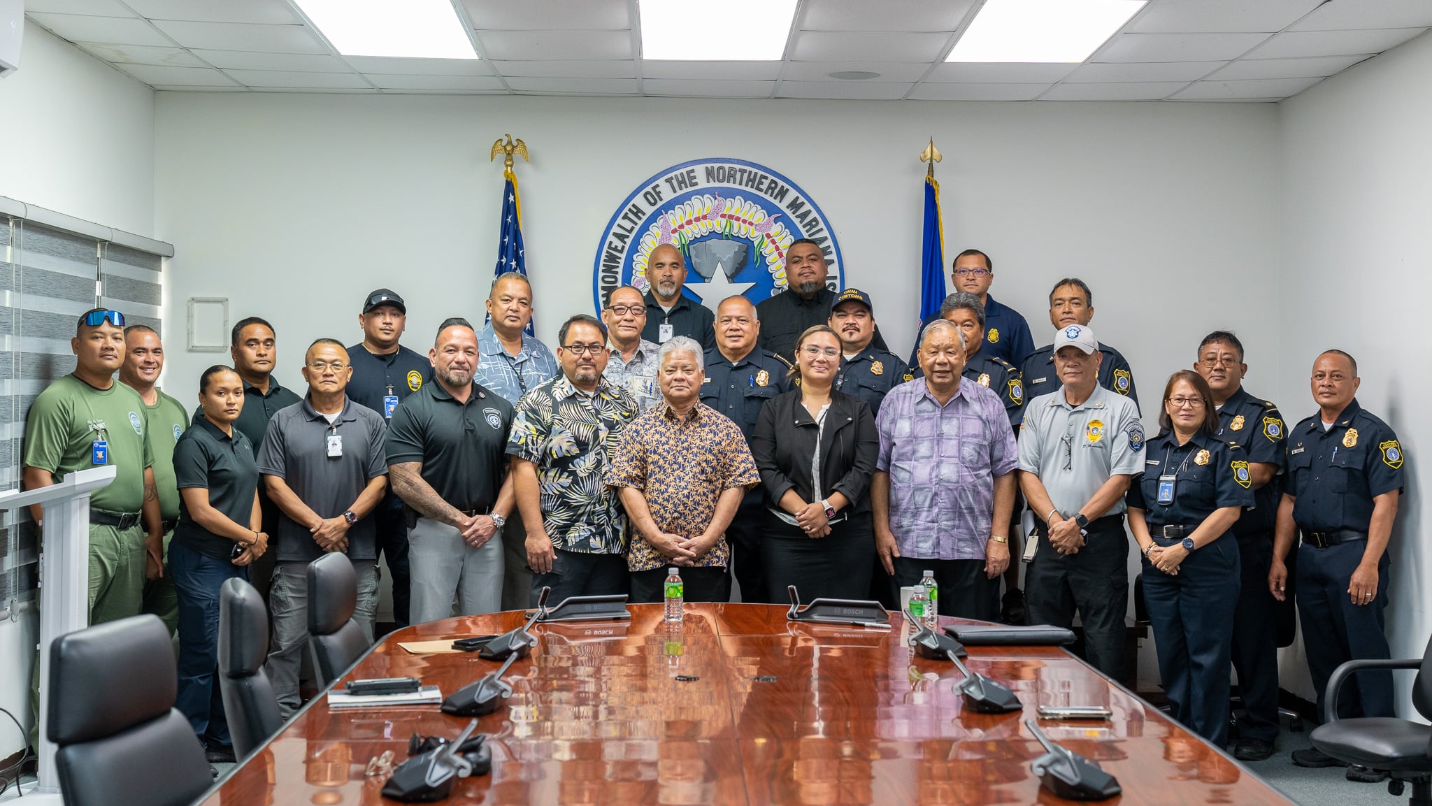 Gov. Arnold I. Palacios and Lt. Gov. David M. Apatang pose for a photo with law enforcement officials and officers following the signing of an agreement to re-establish and reorganize the Joint Drug Prevention Task Force on Wednesday morning at the governor’s office.
