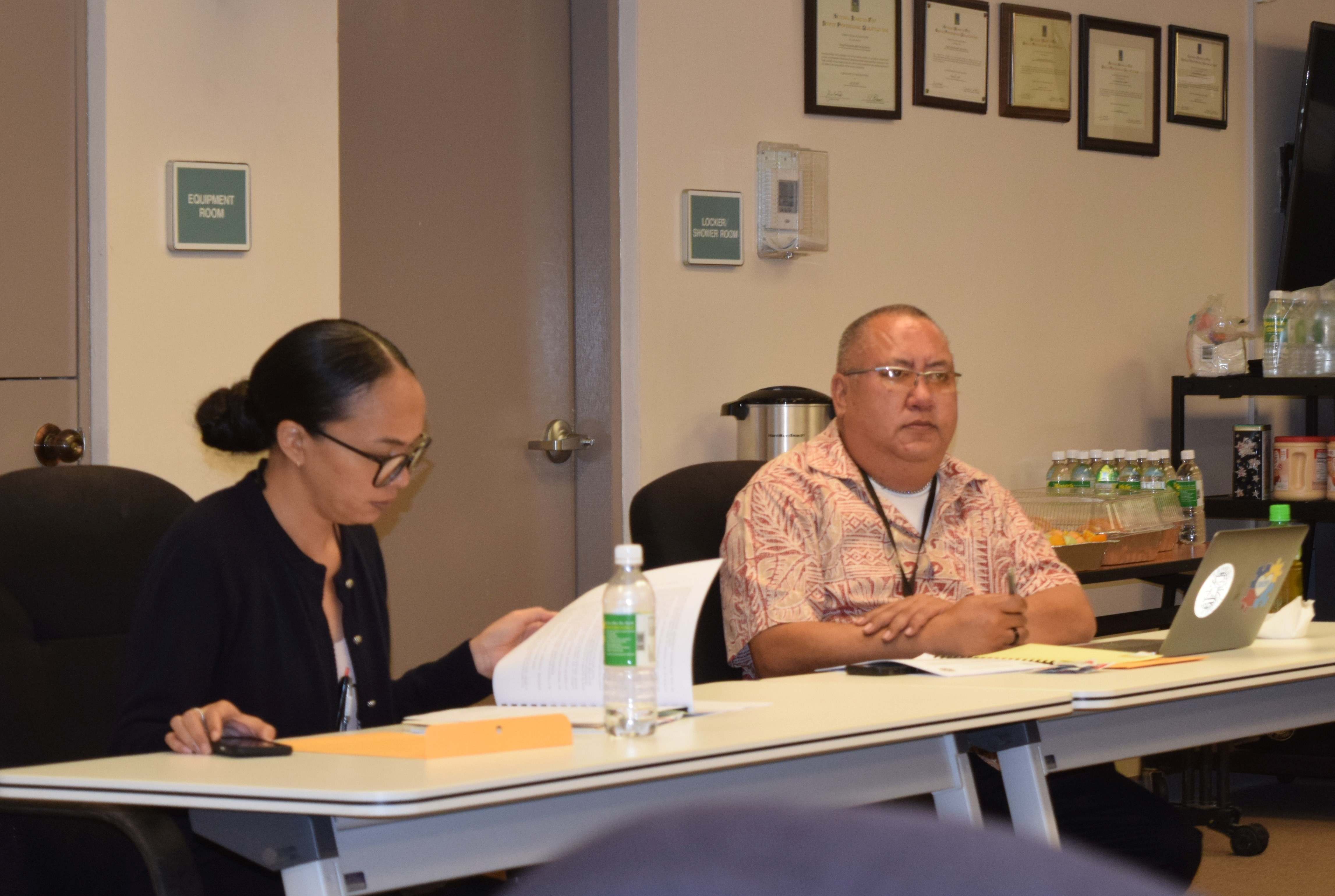 Commonwealth Ports Authority Executive Director Christopher Tenorio, right, listens to the discussion during a board meeting on Friday in the Aircraft Rescue and Firefighting classroom. Also in photo is CPA comptroller Skye Hofschneider.