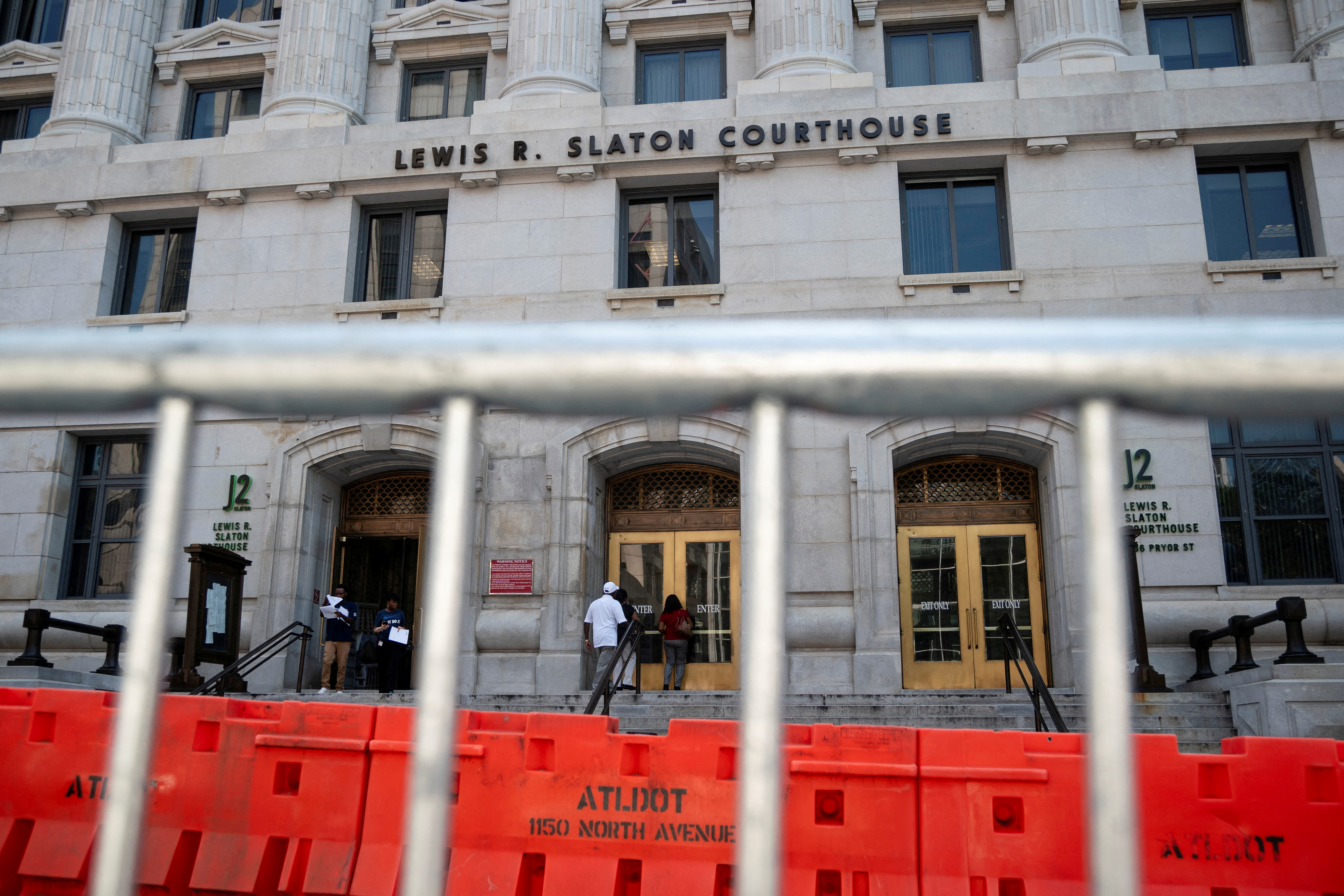Security barriers are seen after the Fulton County Sheriff ordered roads to be closed as officials tighten security around the Lewis R. Slaton Courthouse, as the city prepares for a possible criminal indictment of former U.S. President Donald Trump for his attempts to overturn his election defeat in the state, in Atlanta, Georgia, U.S. August 7, 2023. REUTERS/Elijah Nouvelage